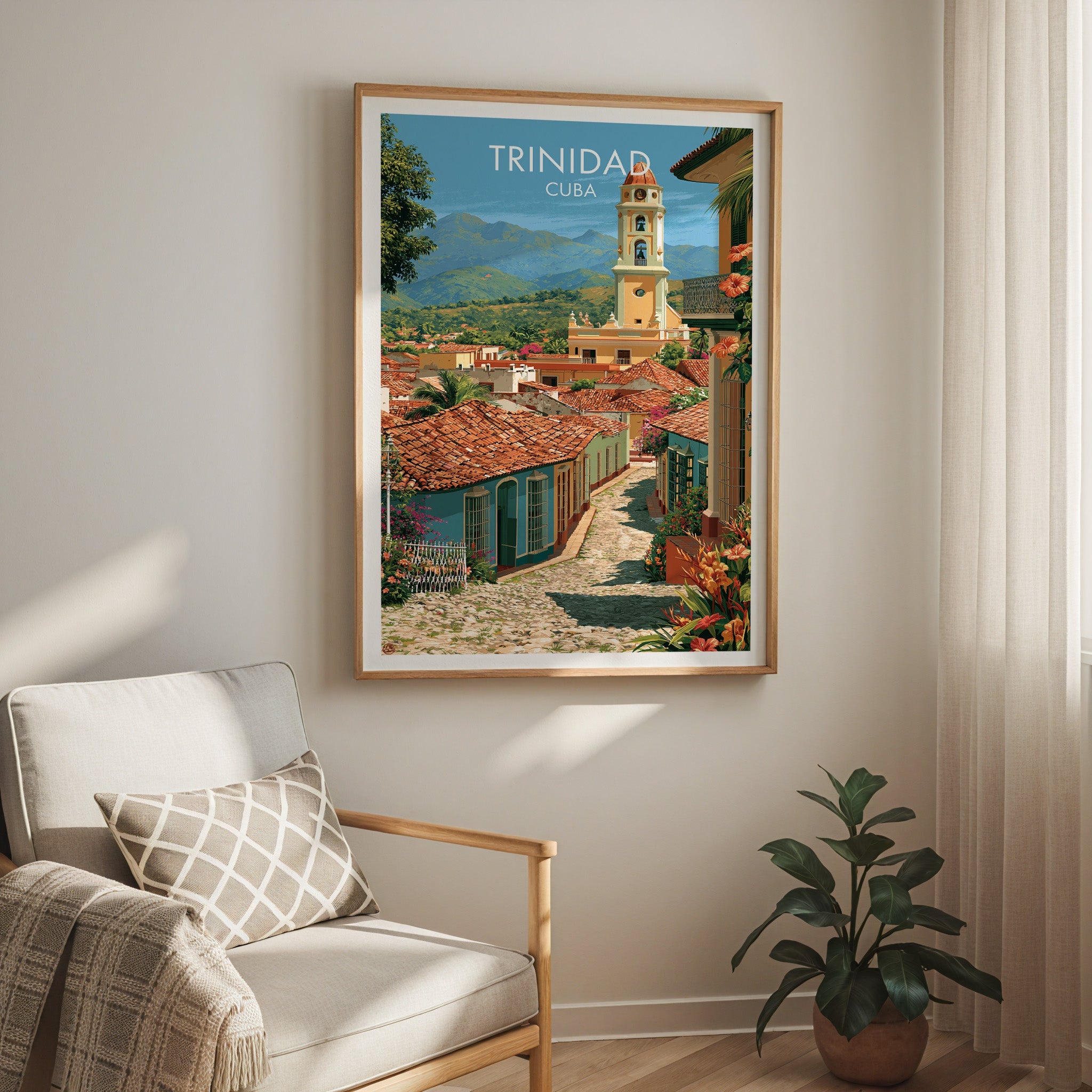 Colonial lane scene in an oak frame above a cream armchair with a check cushion, sheer curtain and rubber plant