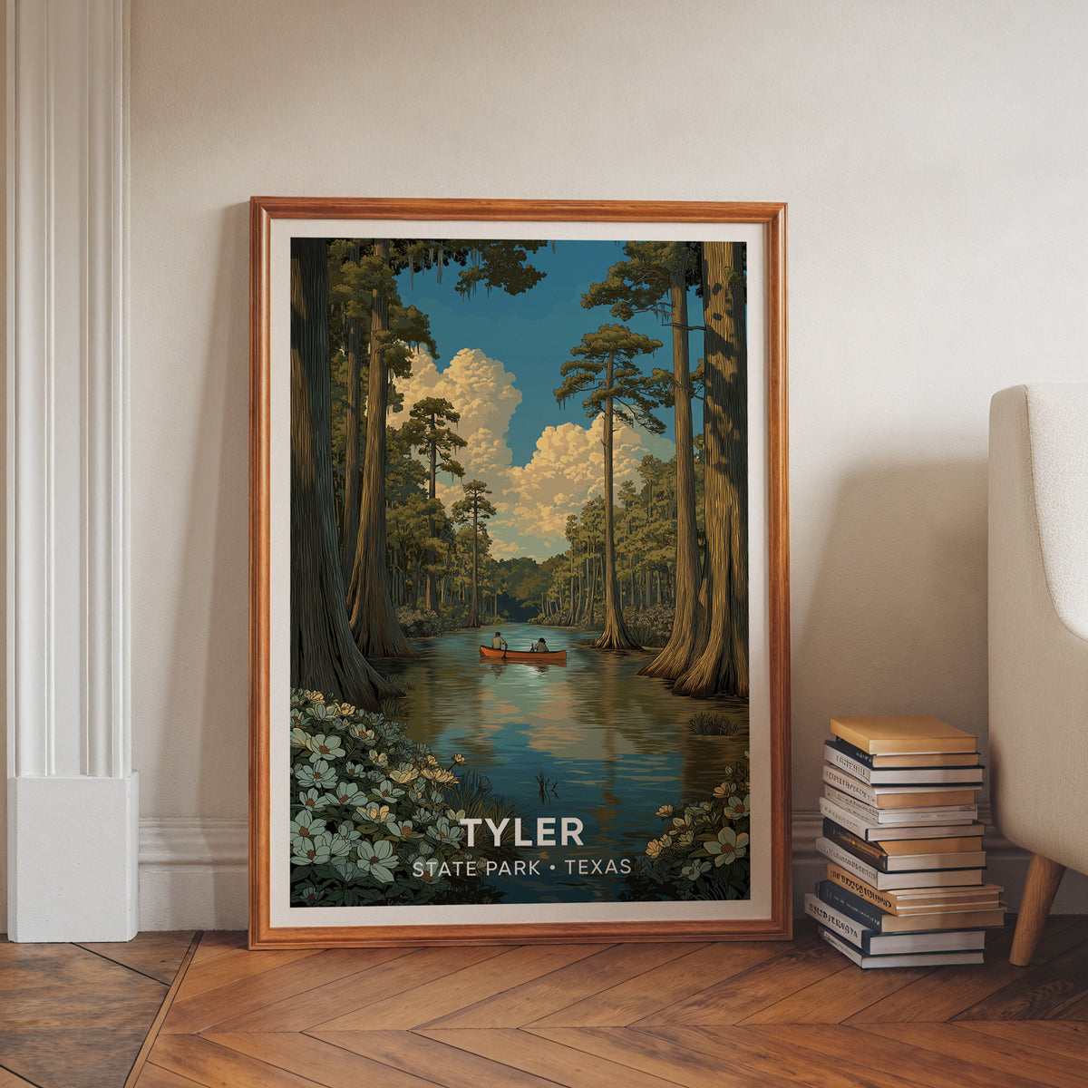 Piney woods canoe print in a walnut frame leaning on a white wall by books and a herringbone floor.