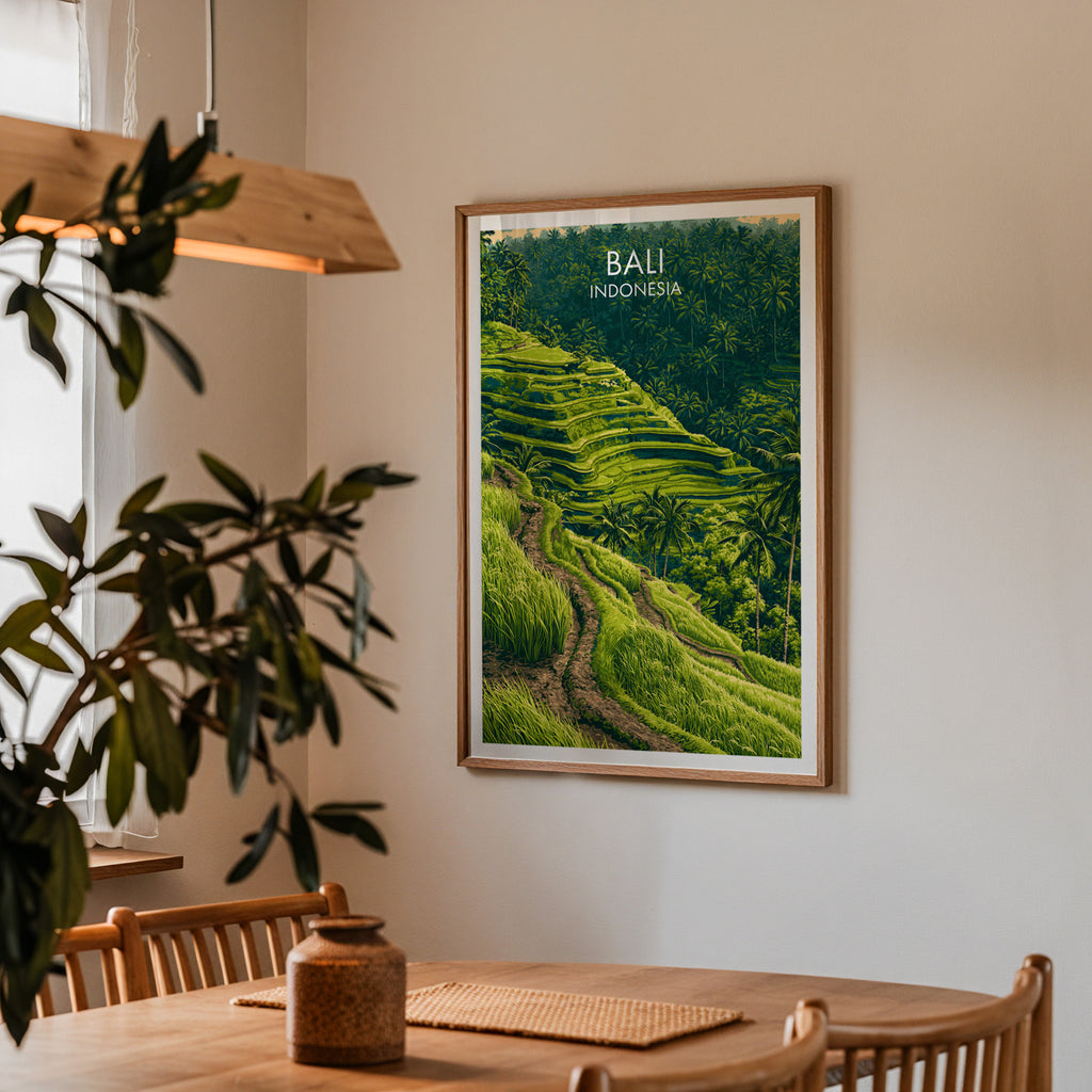 Framed Ubud Rice Terraces Bali print on a dining room wall above an oak table in warm afternoon light