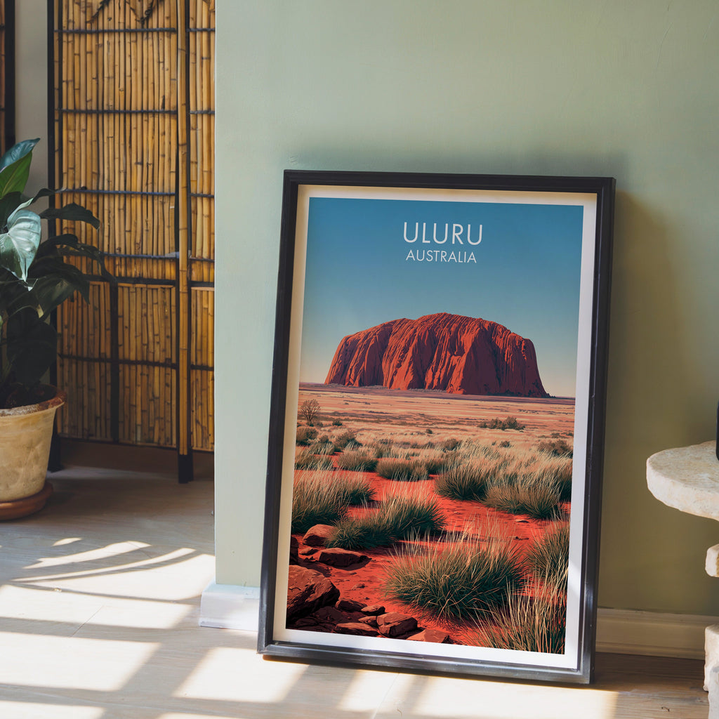 Spinifex plain illustration in a black frame on pale wood floor by a sage wall and bamboo screen