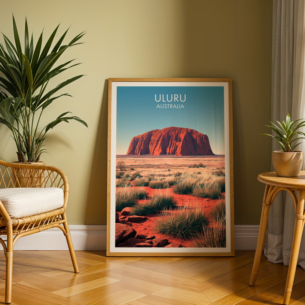 Northern Territory poster in an oak frame on herringbone parquet with an olive wall and rattan chair