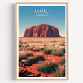 Uluru travel poster in a light oak frame on a plain white wall