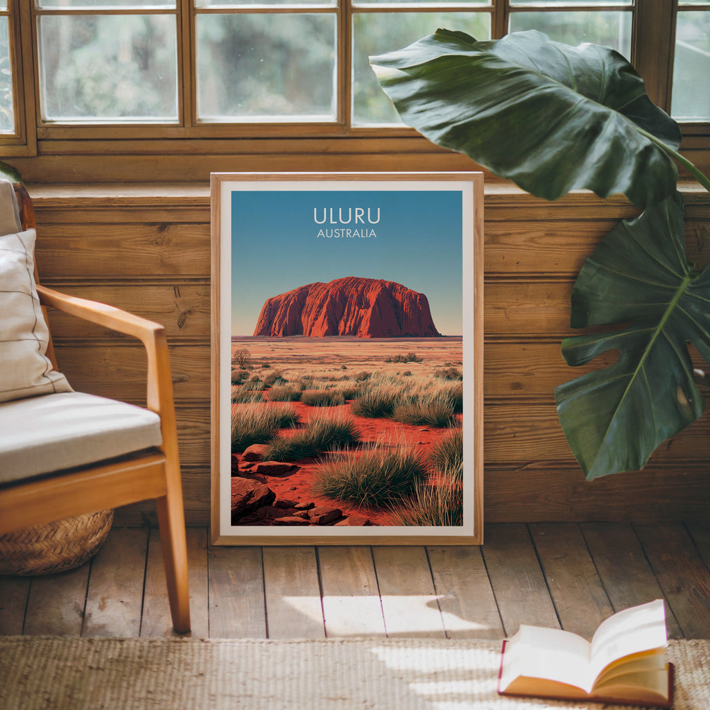 Red sandstone rock poster in an oak frame against a pine cabin wall with an armchair and open book