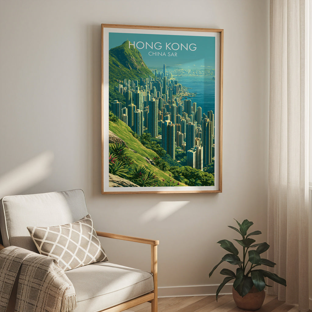 Victoria Peak Hong Kong travel print in a light oak frame on a living room wall beside a linen armchair