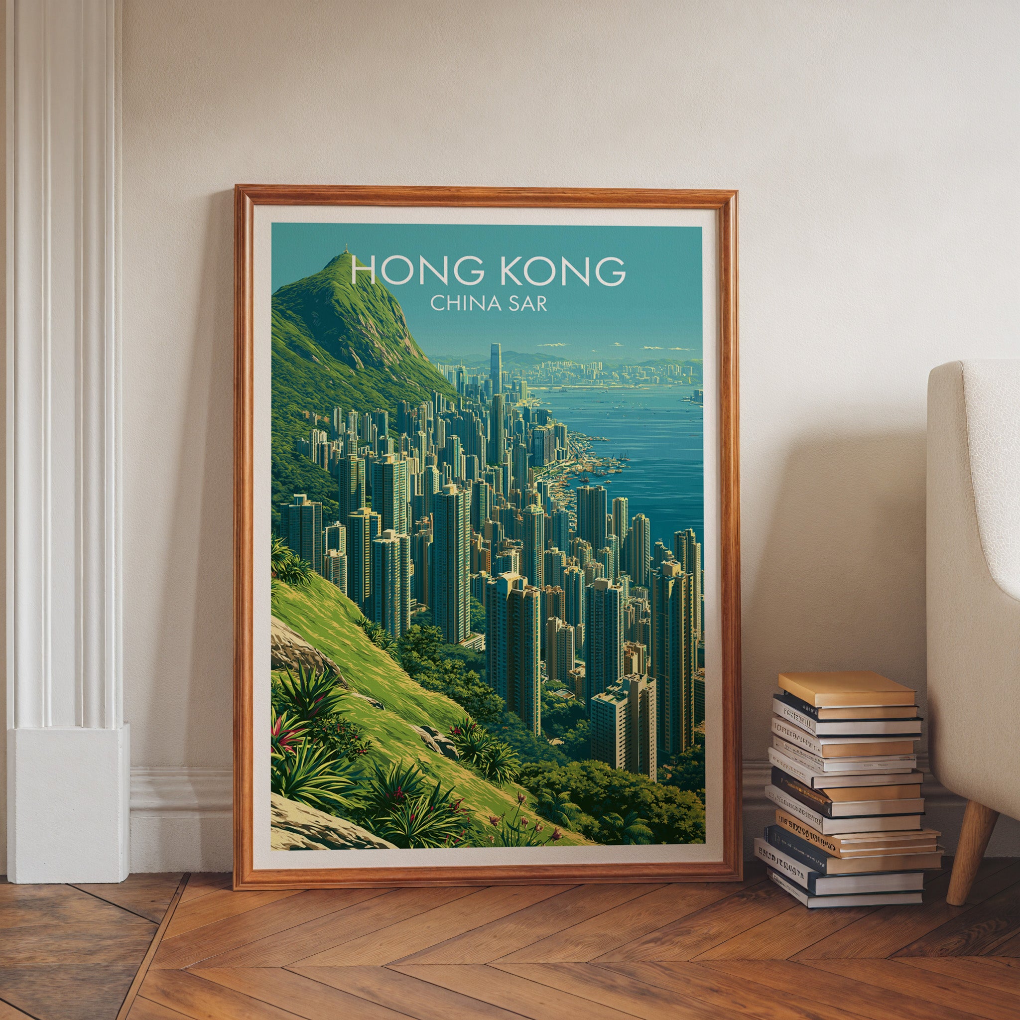 Victoria Peak Hong Kong art print in a walnut frame leaning in a hallway beside stacked books