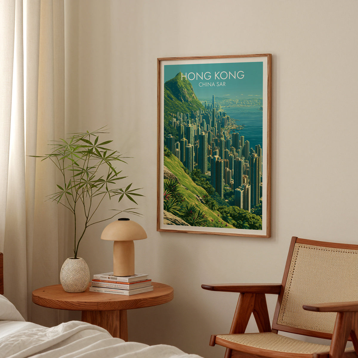 Victoria Peak Hong Kong travel poster in an oak frame above a round bedside table with a mushroom lamp and bamboo stems
