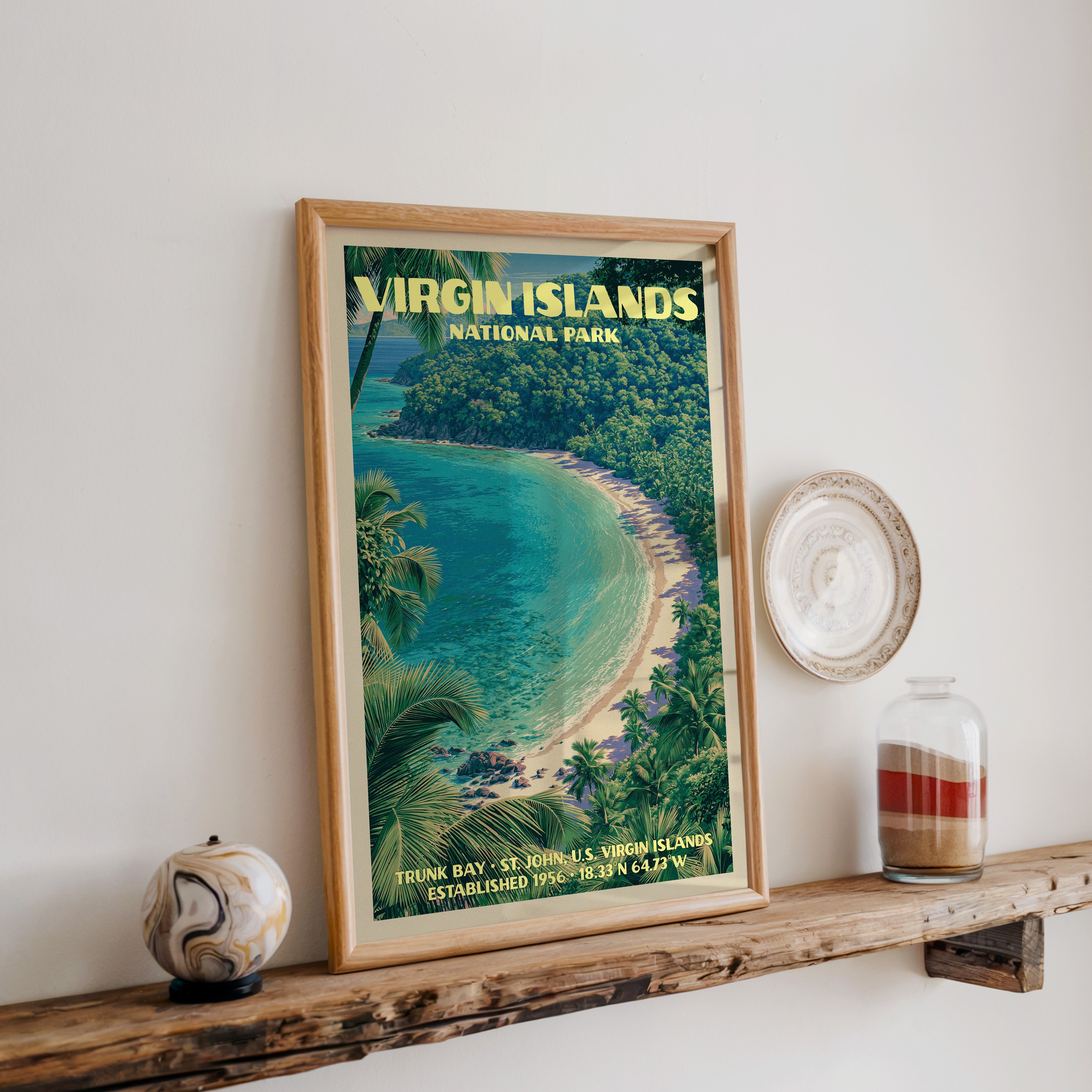 Virgin Islands Trunk Bay print in oak, leaning on a reclaimed wood ledge with a stone sphere and sand jar