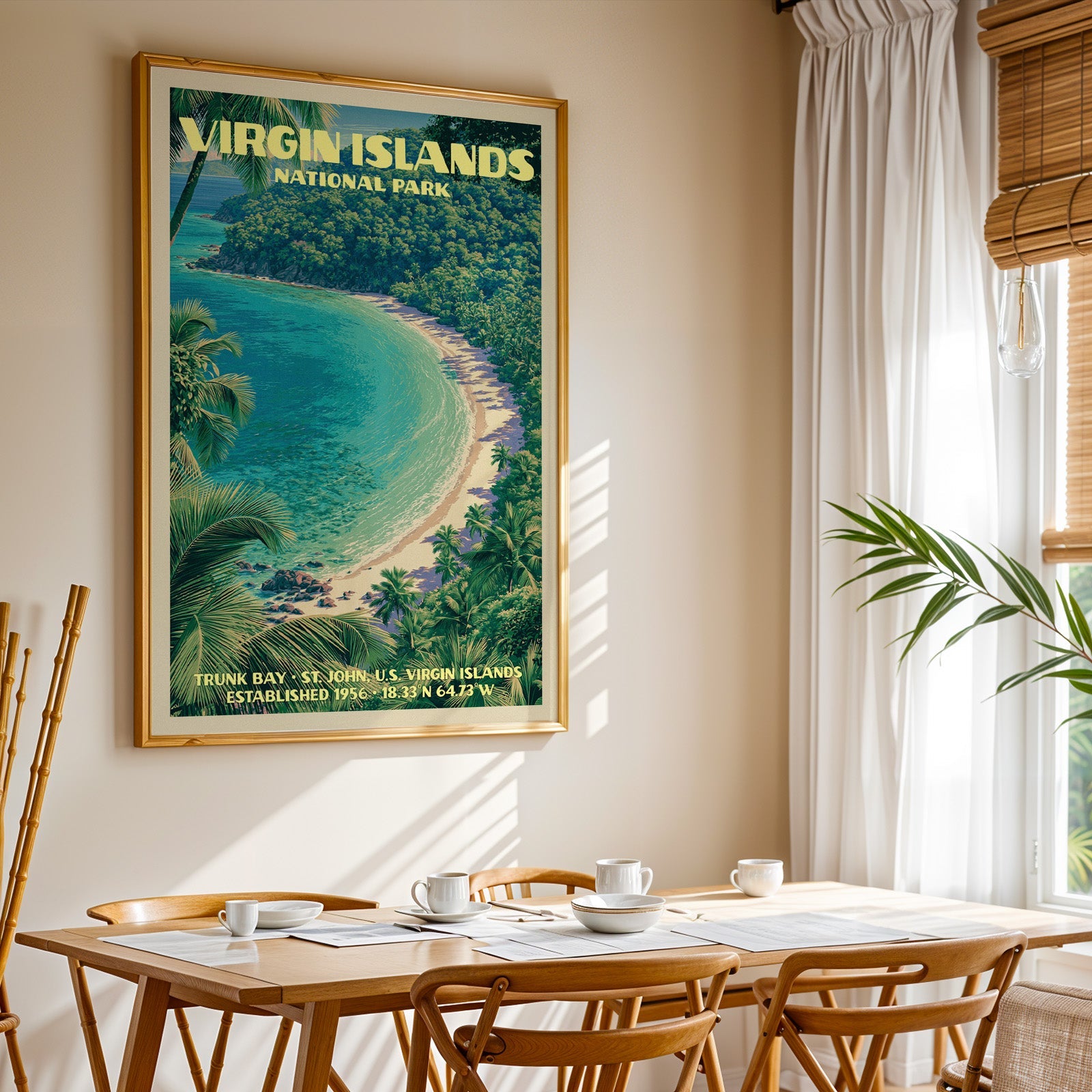 Virgin Islands National Park print in gold above a light oak dining table by a curtained window
