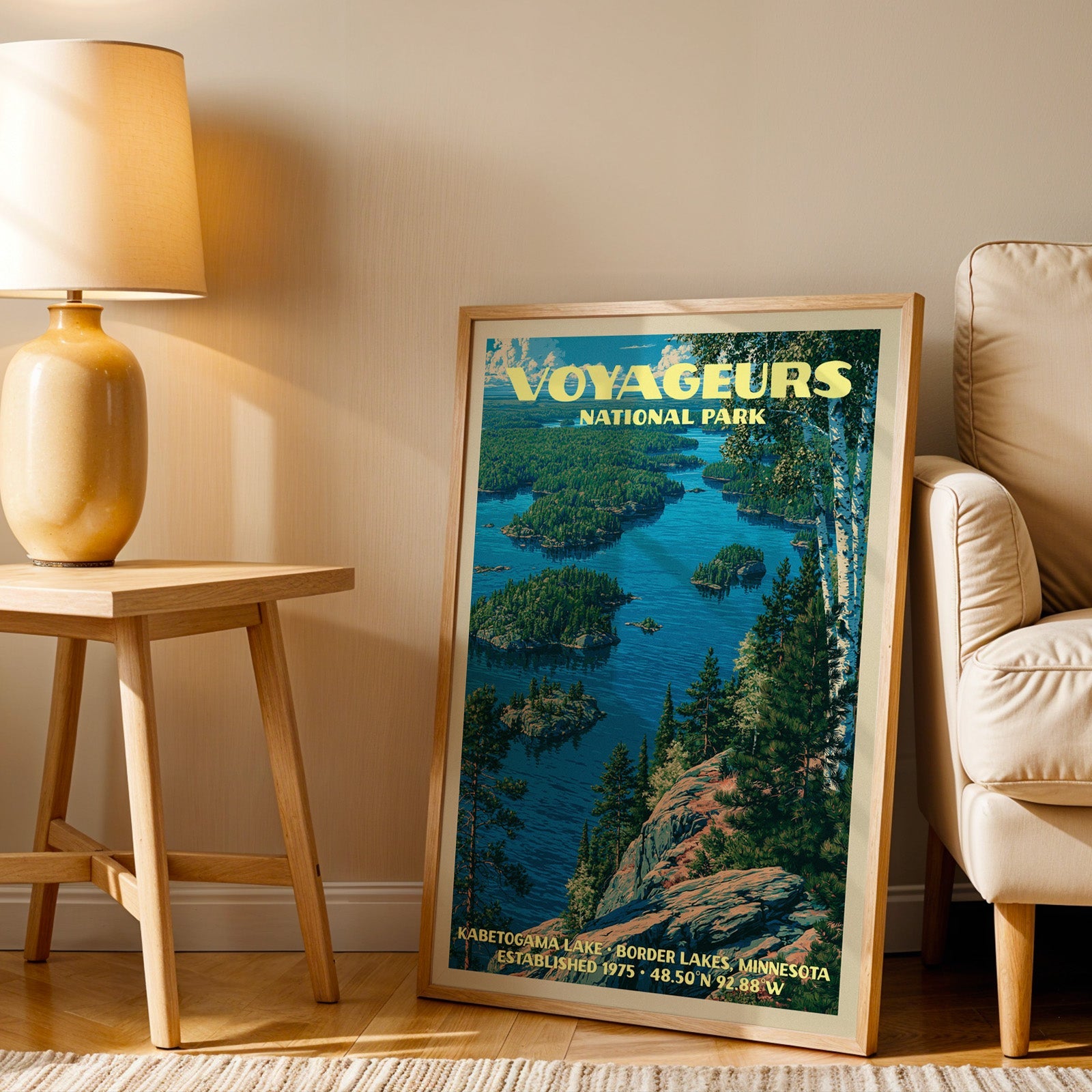 Kabetogama Lake Voyageurs wall art in oak, leaning by an armchair and a side table with an ochre lamp