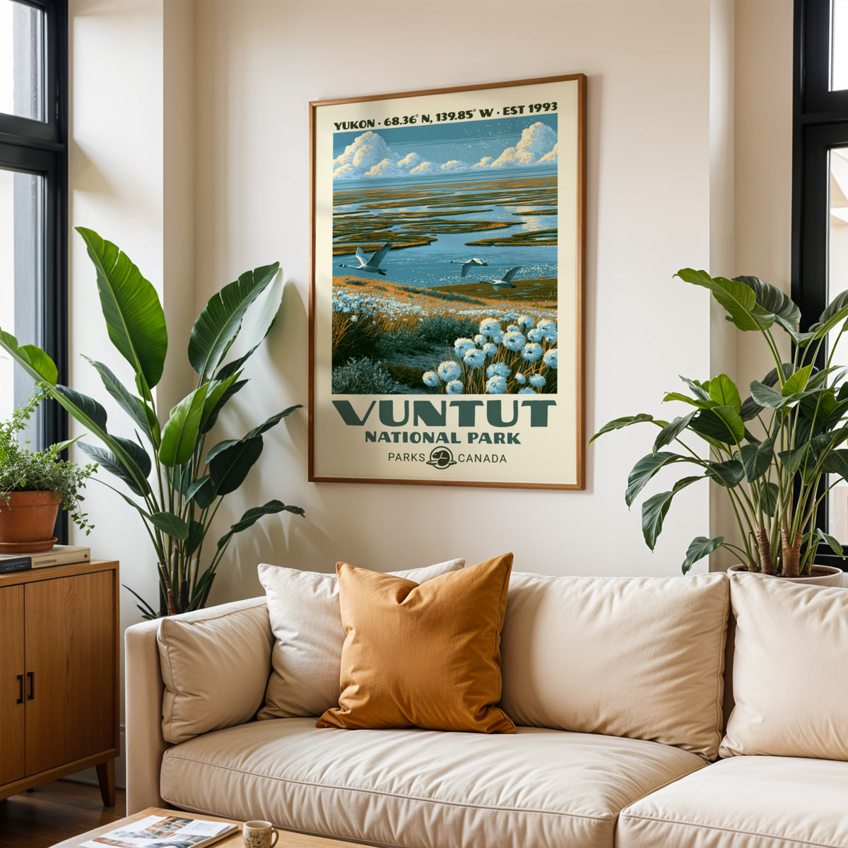 Vuntut cotton grass wetland print in an oak frame above a cream sofa with a rust cushion