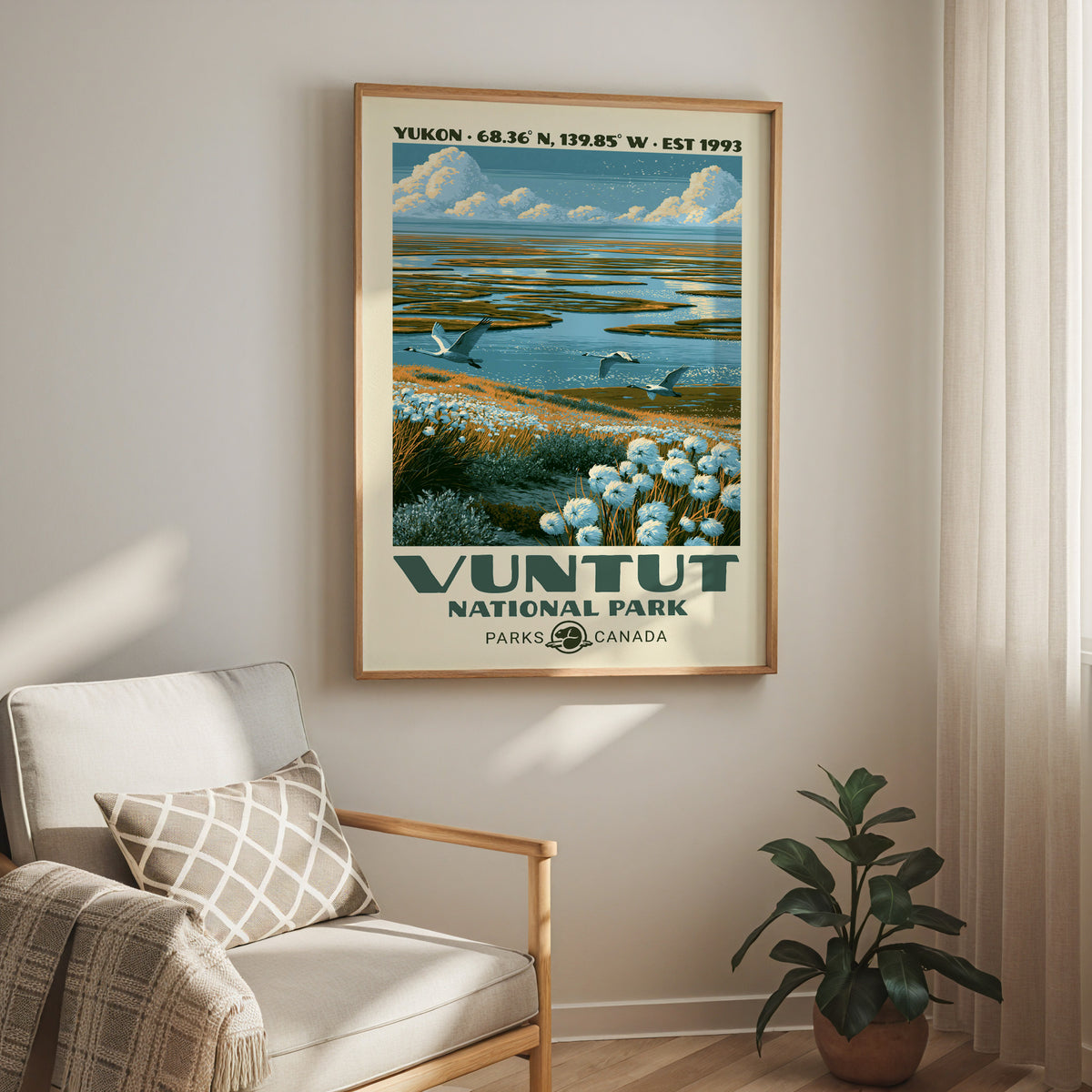 Vuntut cotton grass wetland print in an oak frame above a cream armchair and a rubber plant