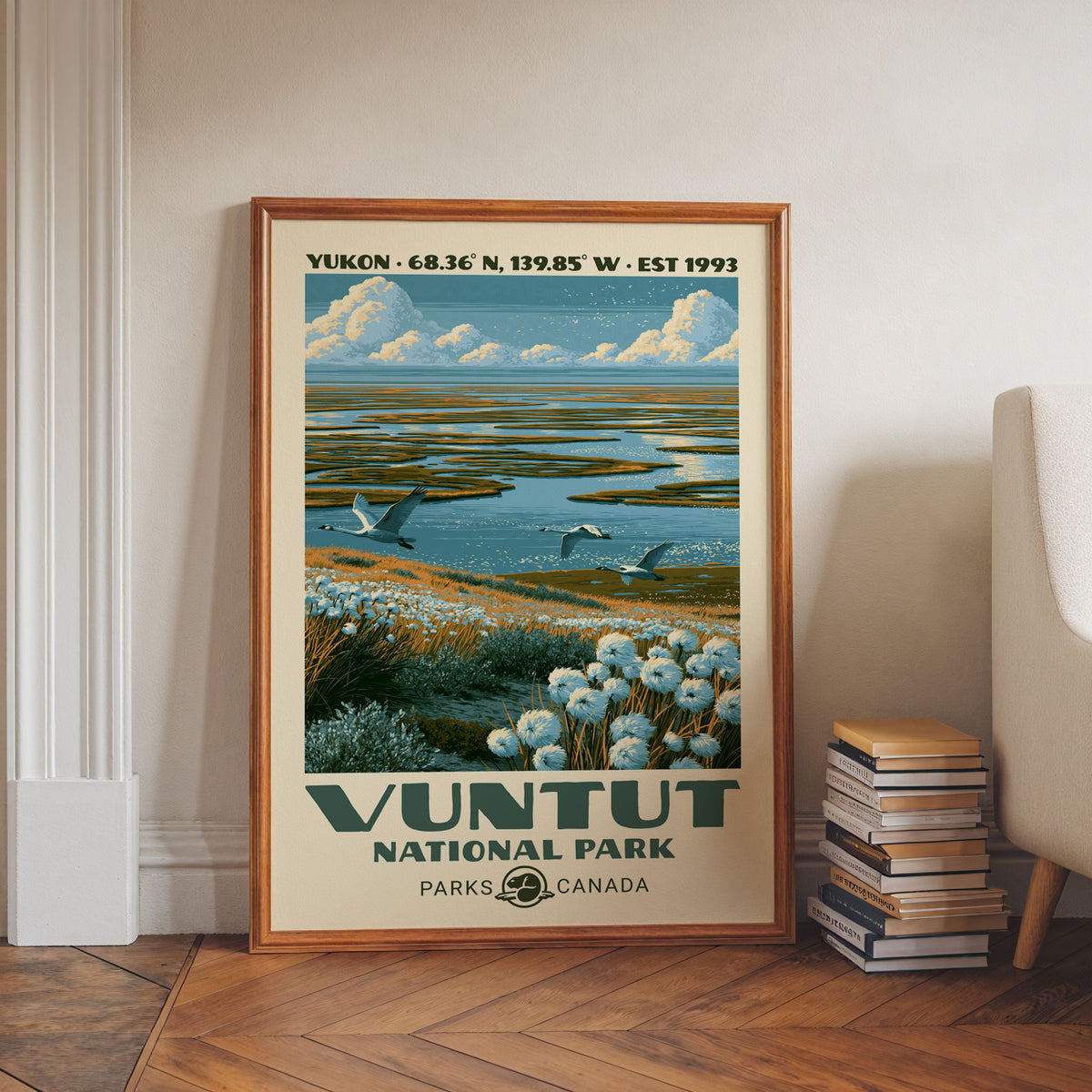 Vuntut National Park wall art, Yukon in a walnut frame on a herringbone floor beside stacked books
