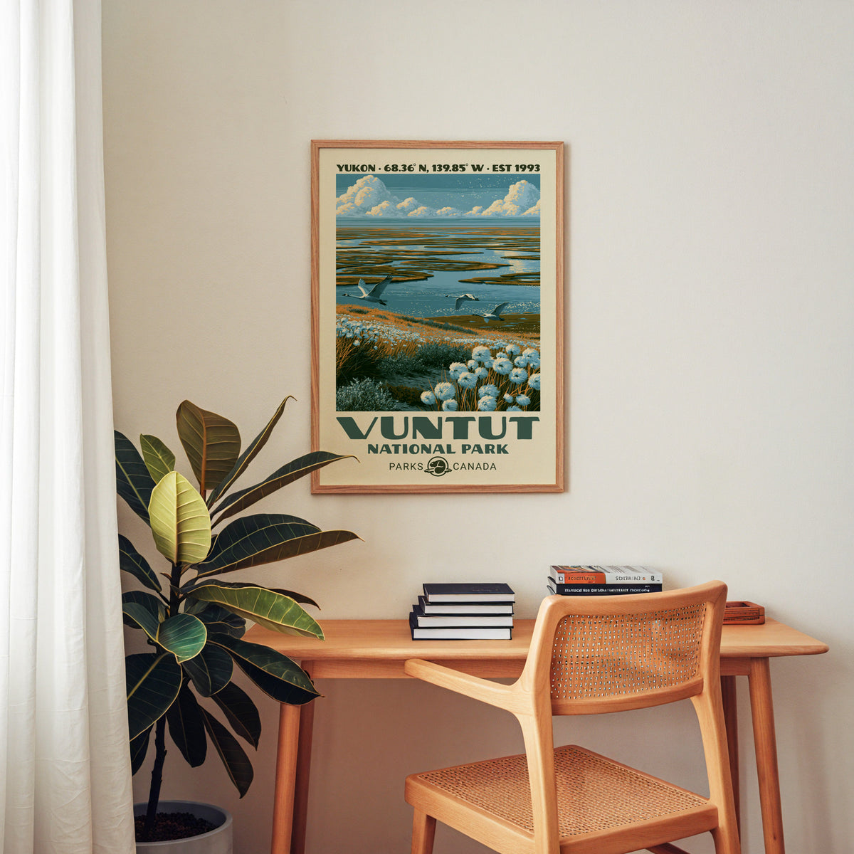 Vuntut National Park canvas print in an oak frame above a wood desk with a cane chair
