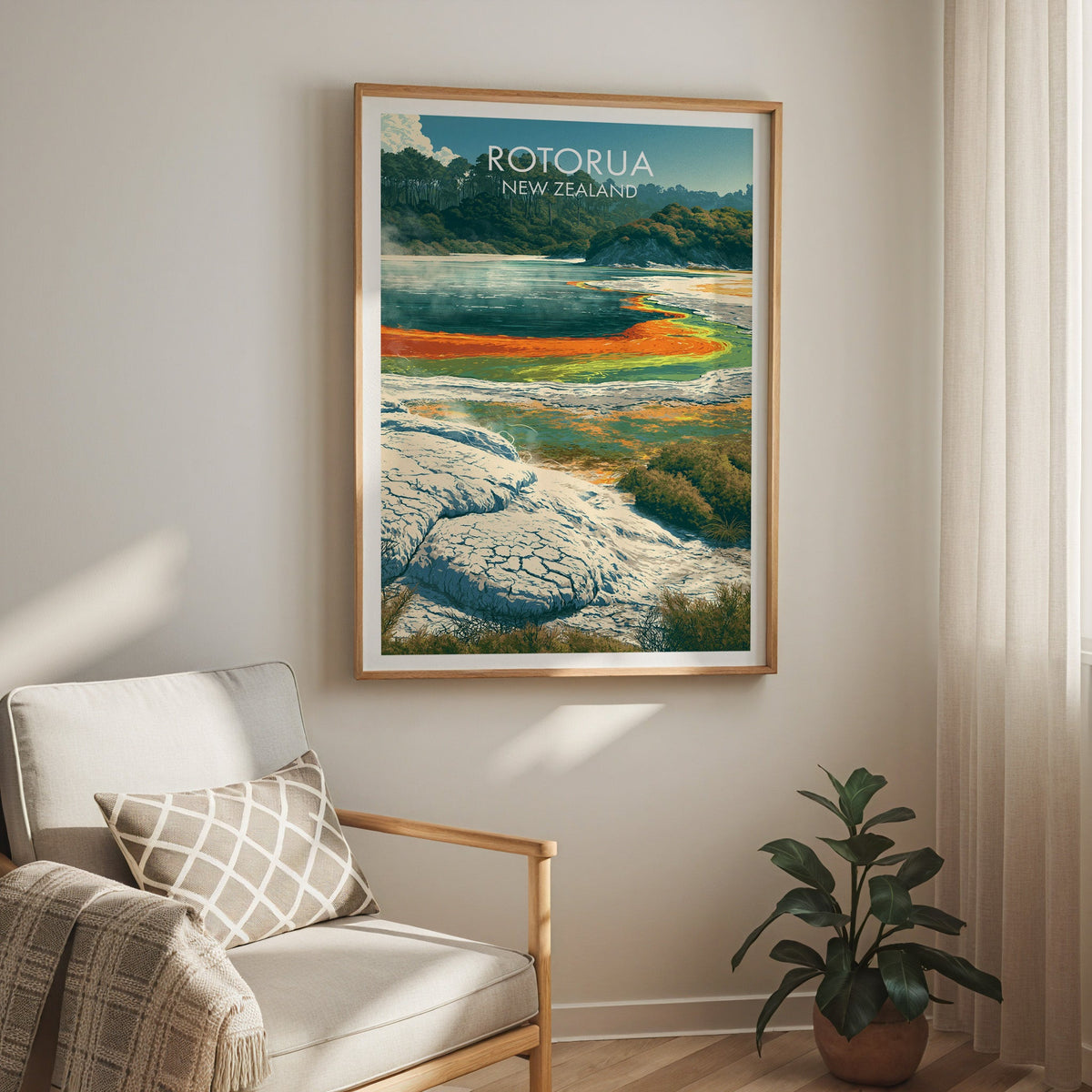 Silica terrace poster hung above a cream armchair with a sheer curtain and a rubber plant