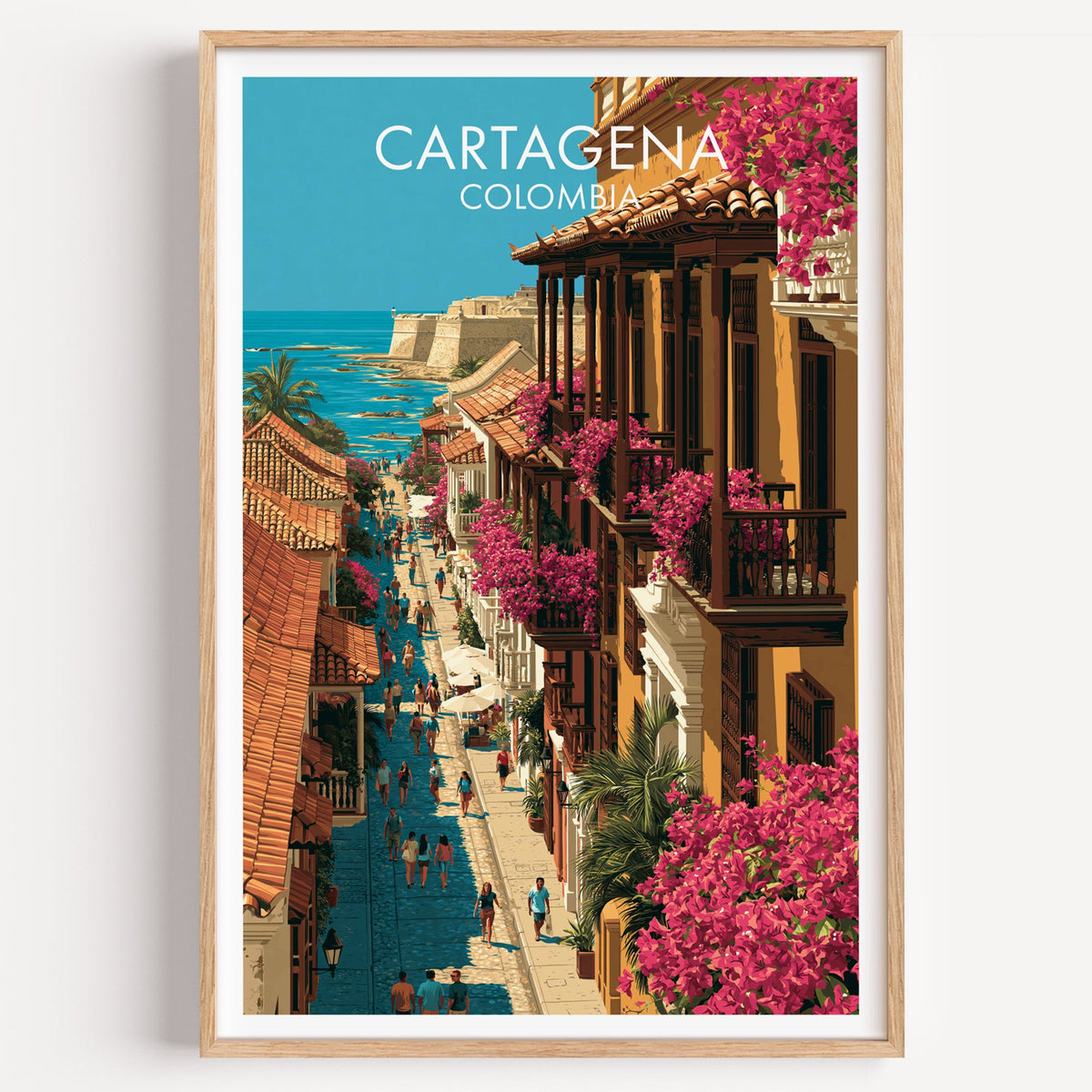 Cartagena Colombia travel print of a bougainvillea-lined old town street in a light oak frame on a white wall