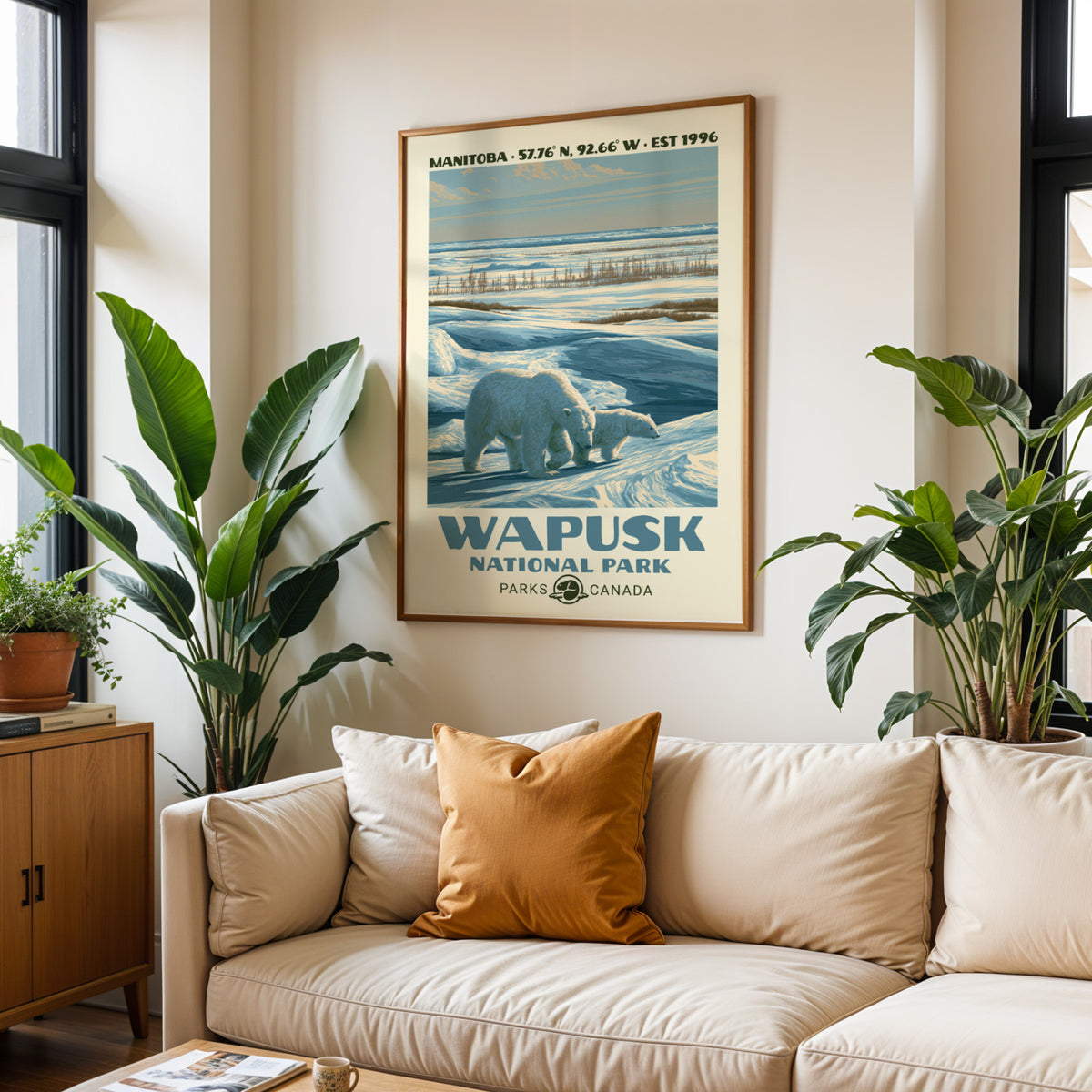 Wapusk National Park print in an oak frame above a cream sofa with a rust cushion
