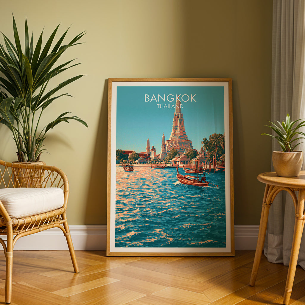 Large Wat Arun Bangkok Thailand travel print in an oak frame leaning on a herringbone floor next to a rattan chair