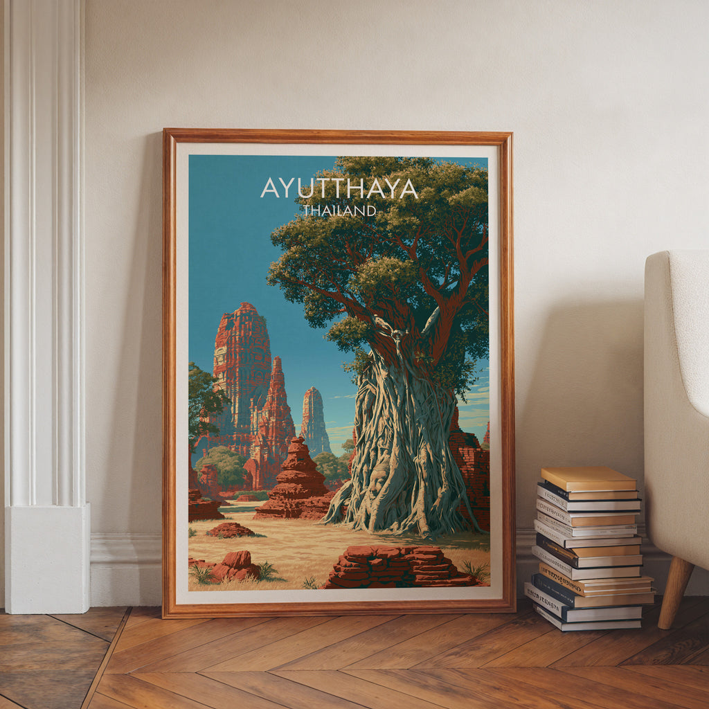 Wat Mahathat Ayutthaya Thailand art print in a walnut frame leaning in a hallway beside stacked books