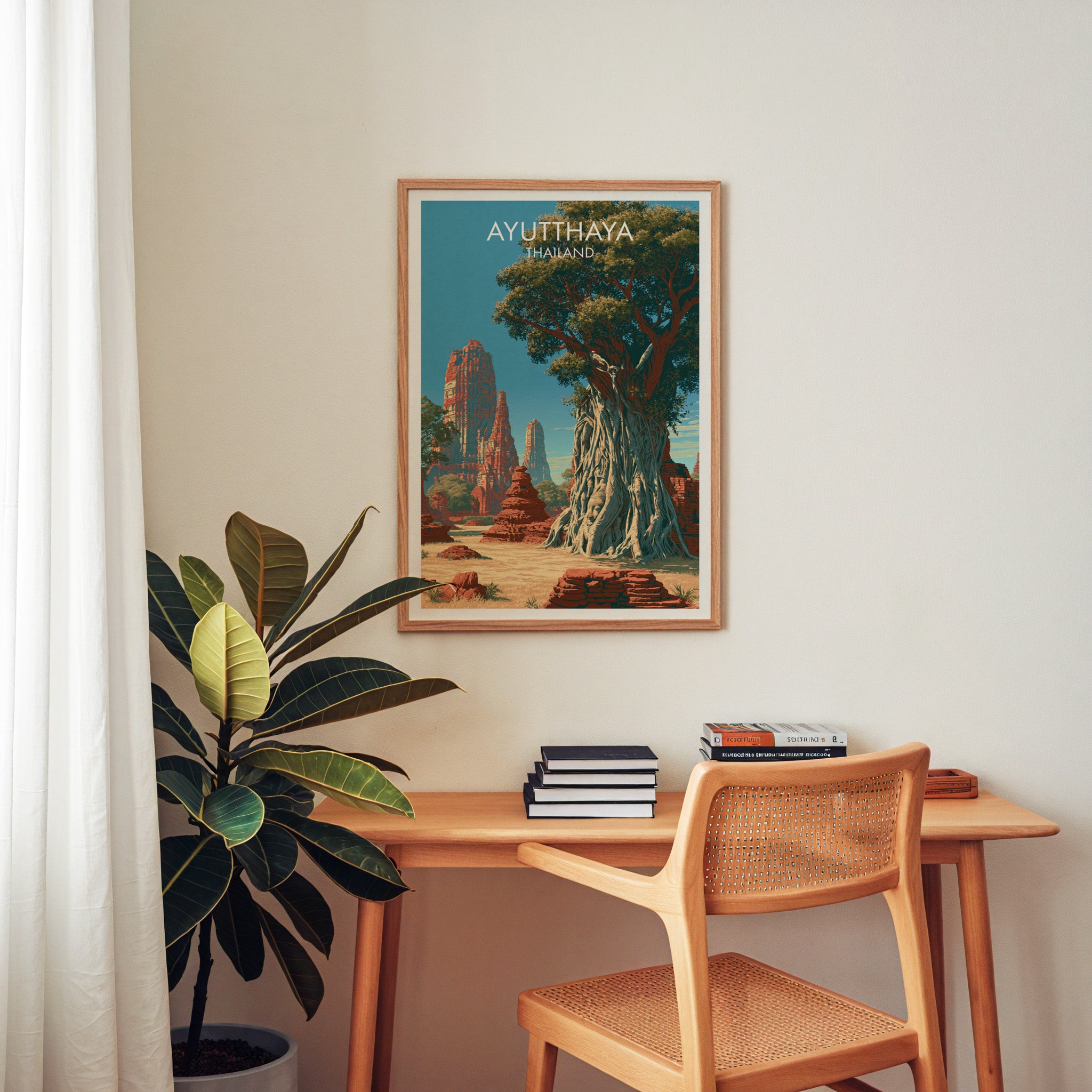 Wat Mahathat Ayutthaya Thailand wall art above a wooden home office desk with a rattan chair and books