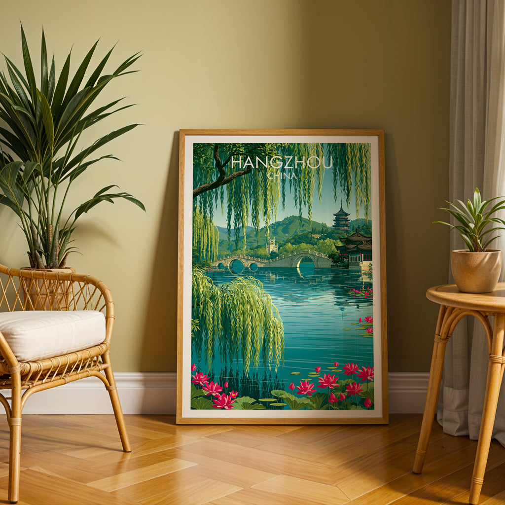 Large West Lake Hangzhou China travel print in an oak frame leaning on a herringbone floor next to a rattan chair