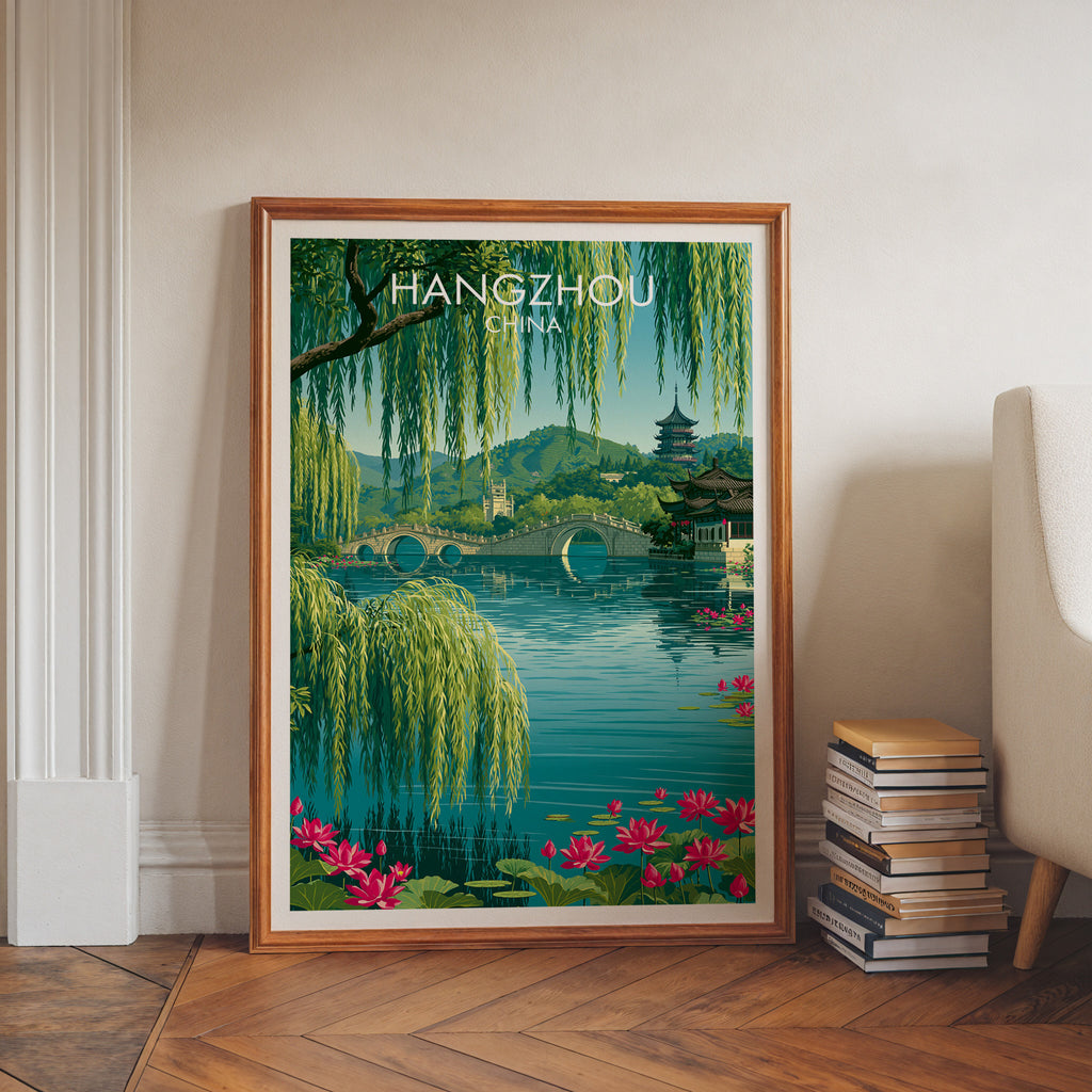 West Lake Hangzhou China art print in a walnut frame leaning in a hallway beside stacked books