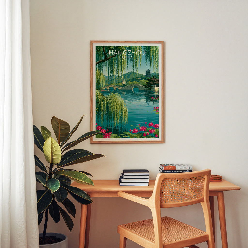 West Lake Hangzhou China wall art above a wooden home office desk with a rattan chair and books