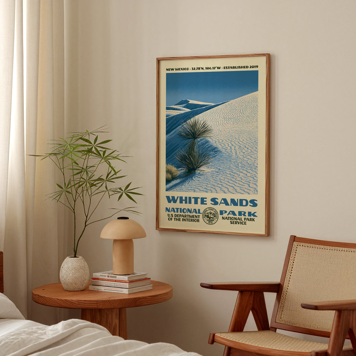 White Sands National Park vintage WPA print hanging above a side table in a calm bedroom corner