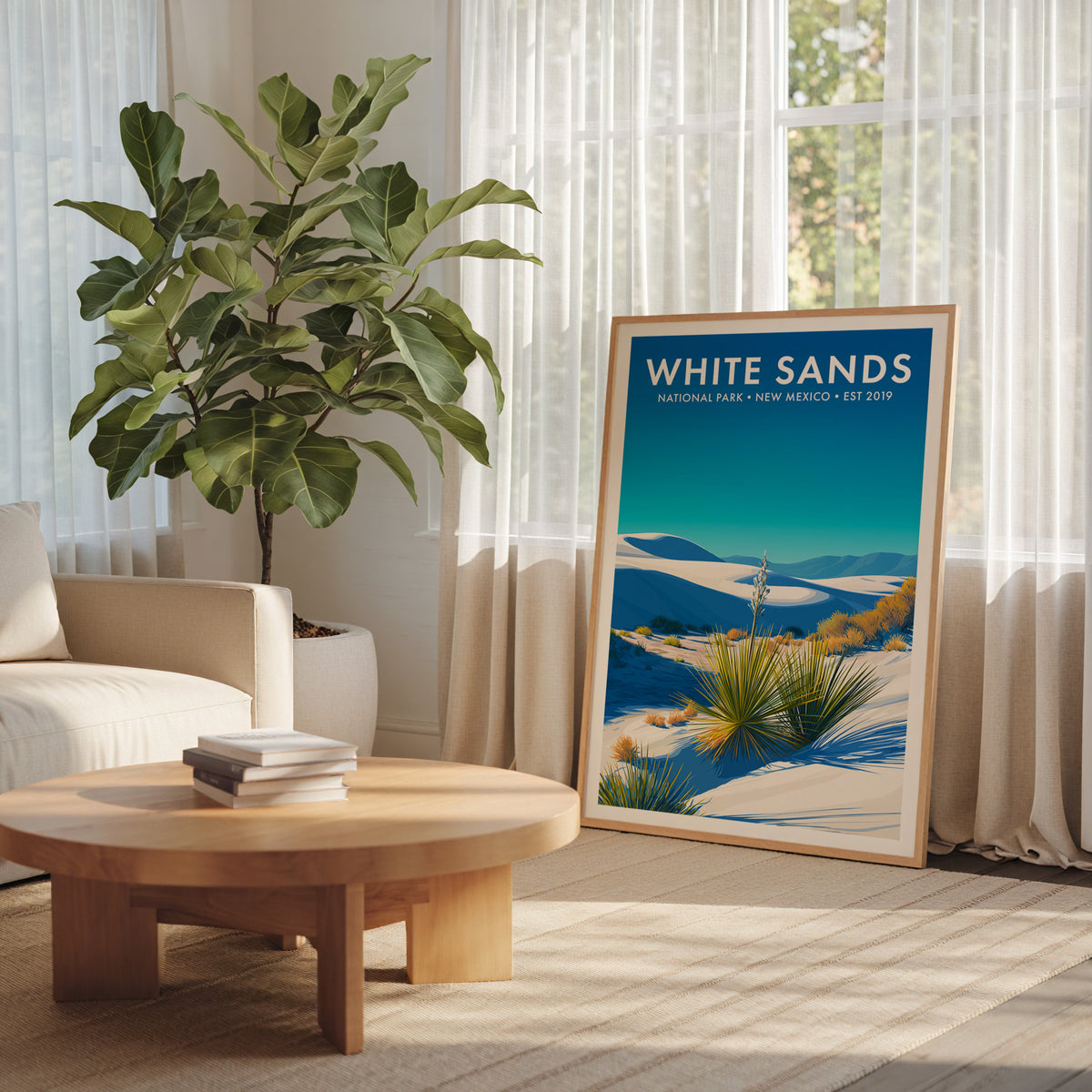 White Sands National Park mid-century modern art print leaning in a bright minimalist living room with a fiddle-leaf fig — living room wall art