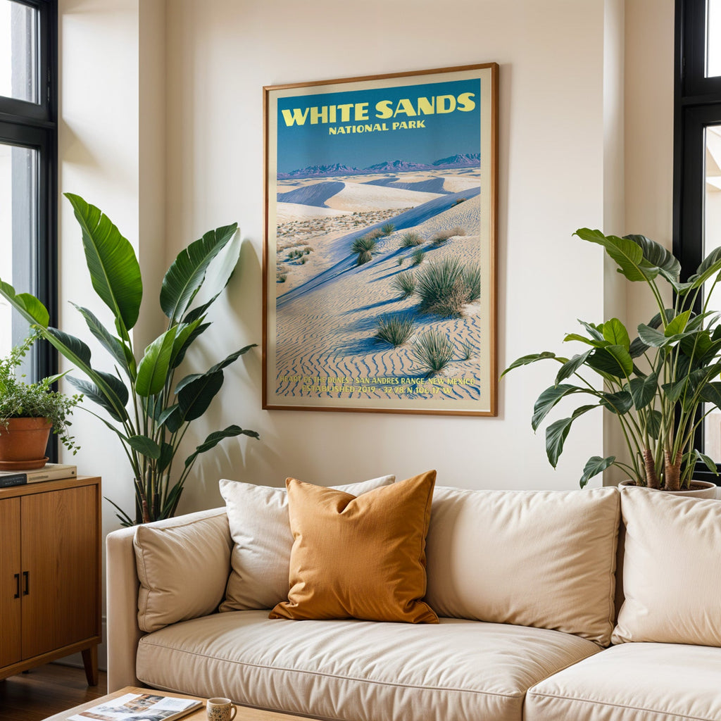 White Sands vintage travel print in oak above a cream sofa with a rust cushion and tall tropical plants