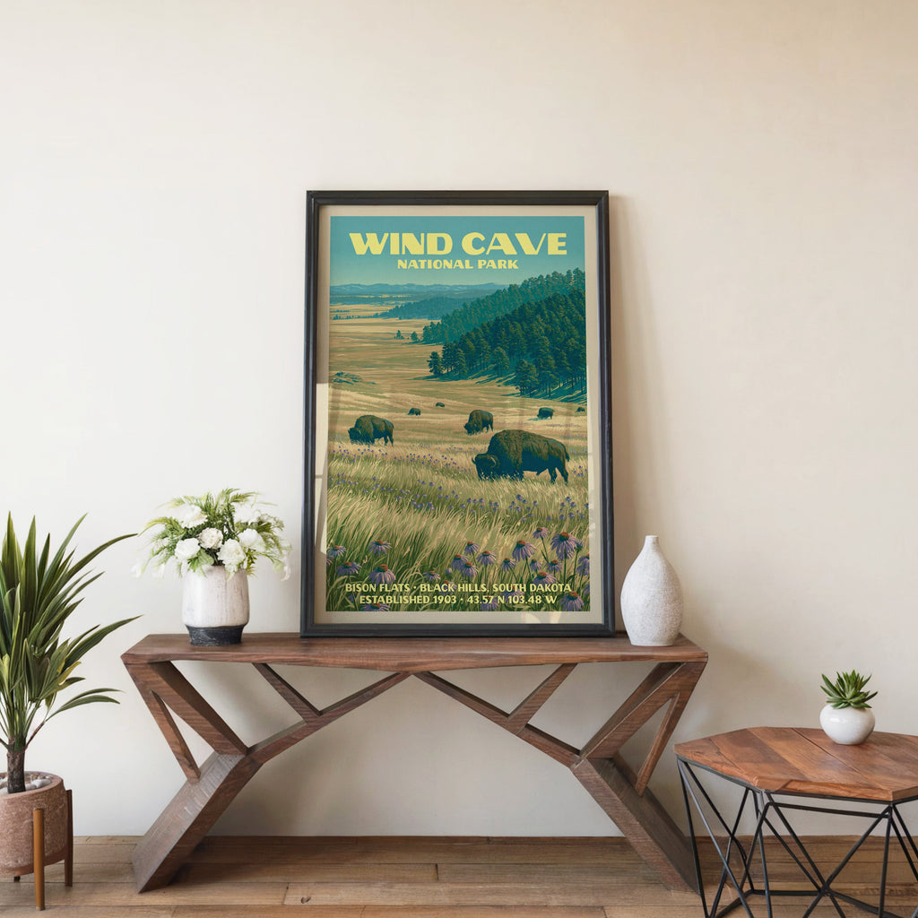 Bison Flats wall art in black, leaning on a walnut console with white anemones and a small ceramic vase