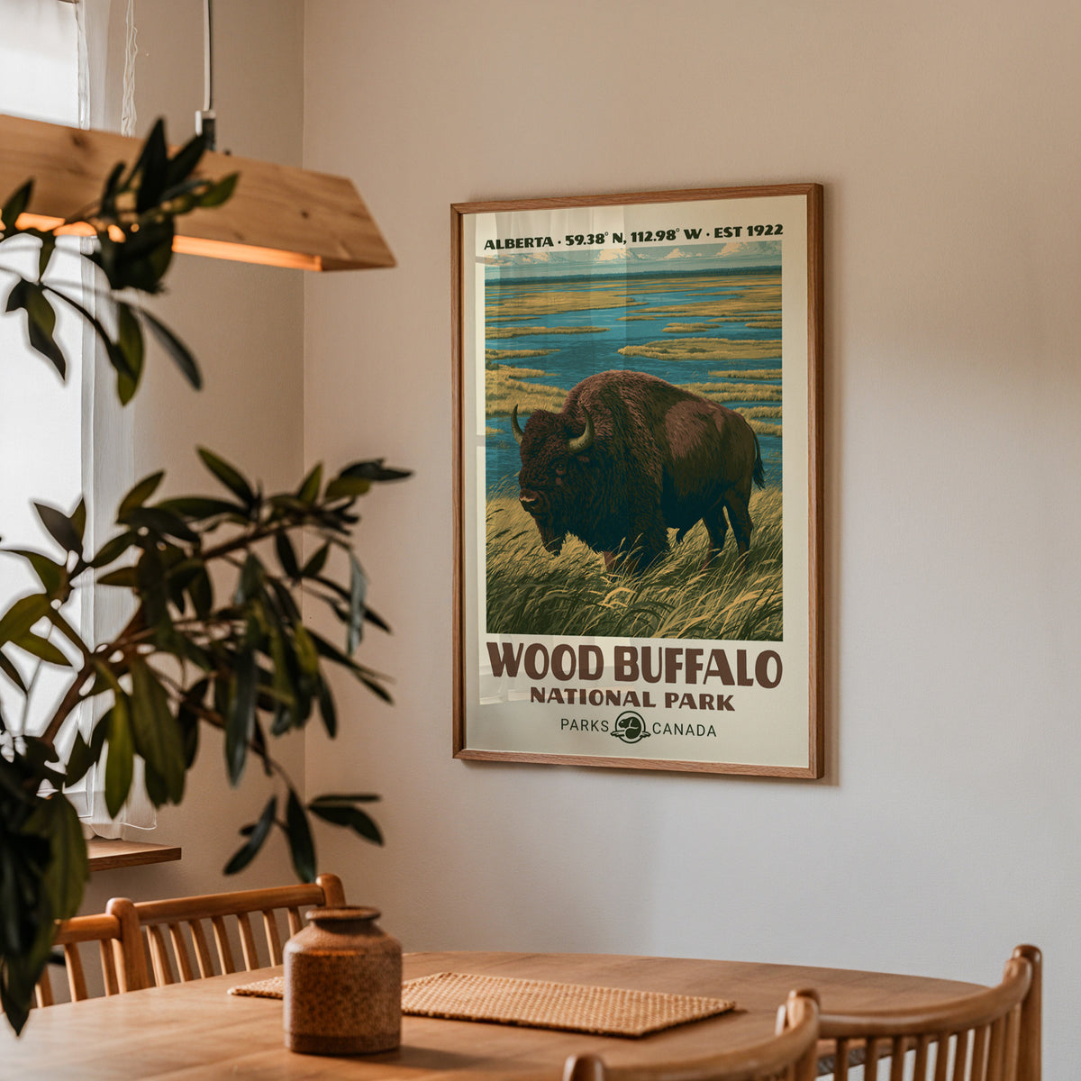 Wood Buffalo wood bison poster in an oak frame in a dining corner above an oak table
