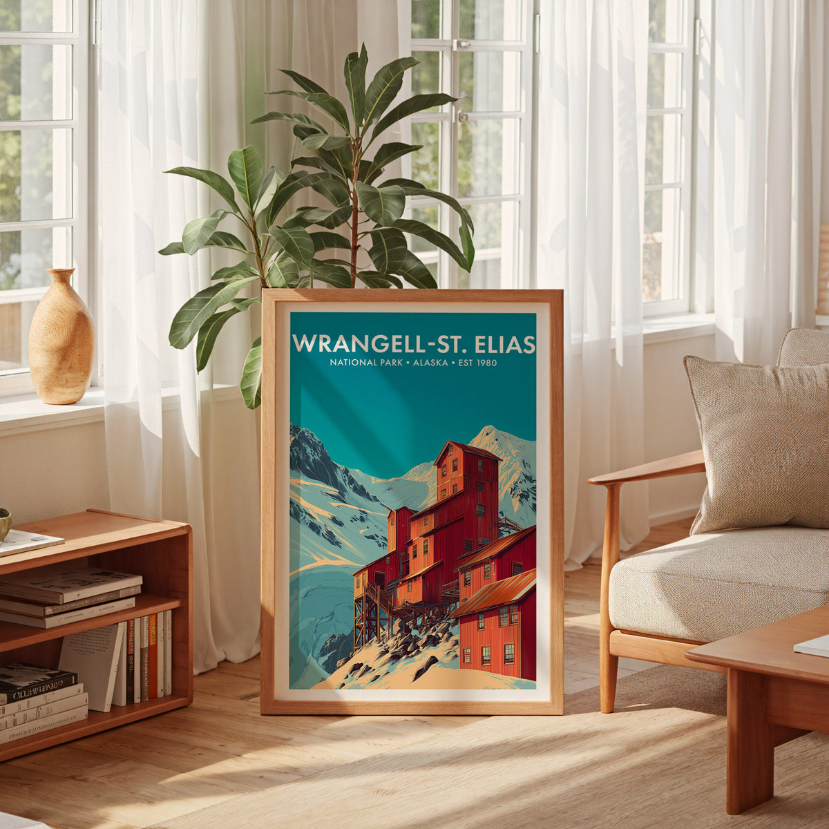 Wrangell–St. Elias National Park mid-century modern art print leaning in a sun-filled living room beside an armchair — living room wall art