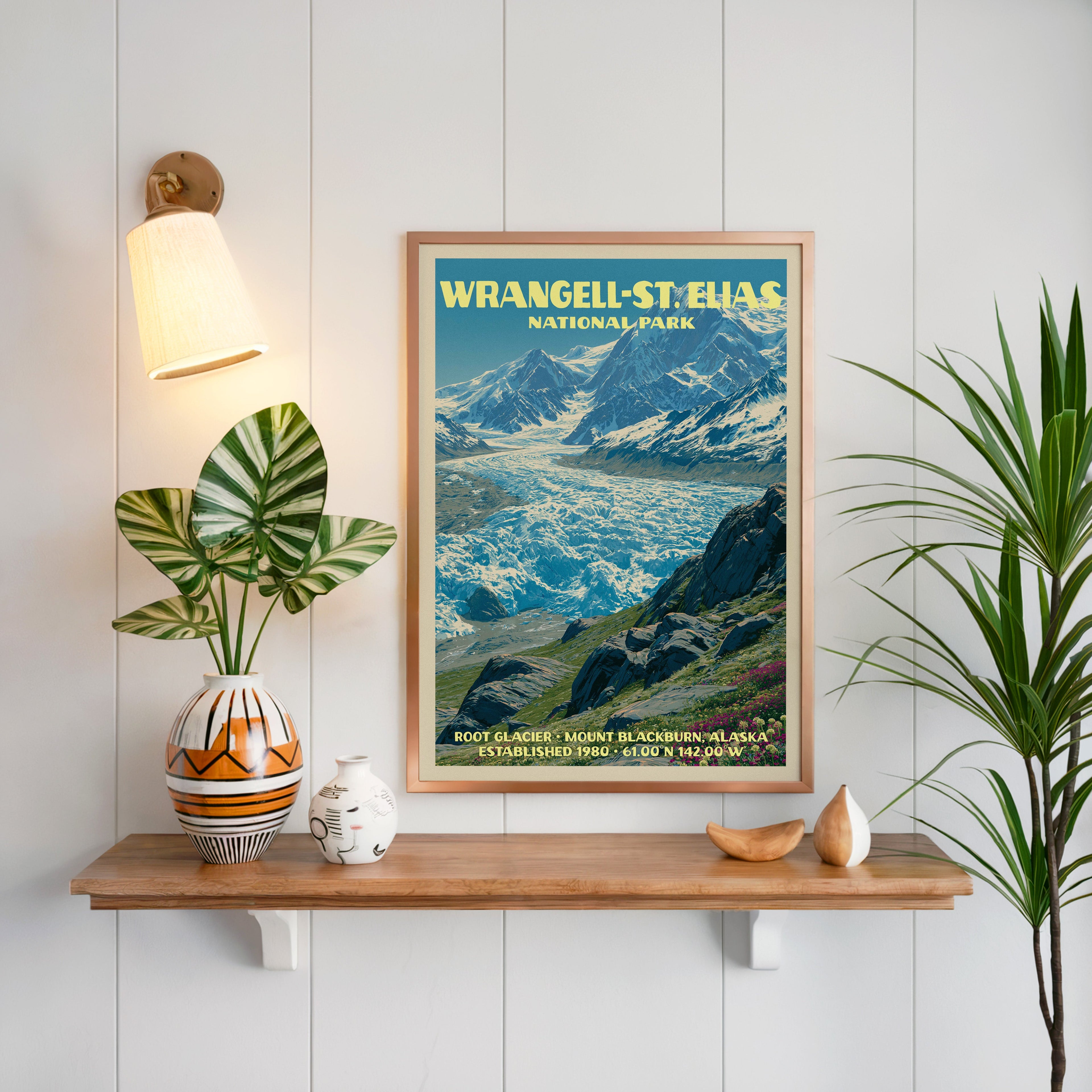Root Glacier print framed in oak on white panelling above a floating shelf with a patterned vase and sconce