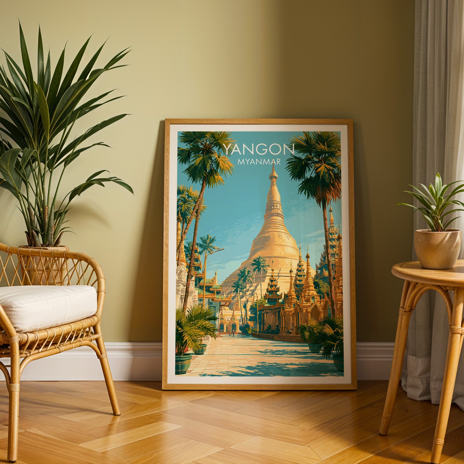 Large Yangon Myanmar travel print in an oak frame leaning on a herringbone floor next to a rattan chair