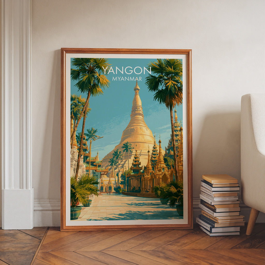Yangon Myanmar art print in a walnut frame leaning in a hallway beside stacked books