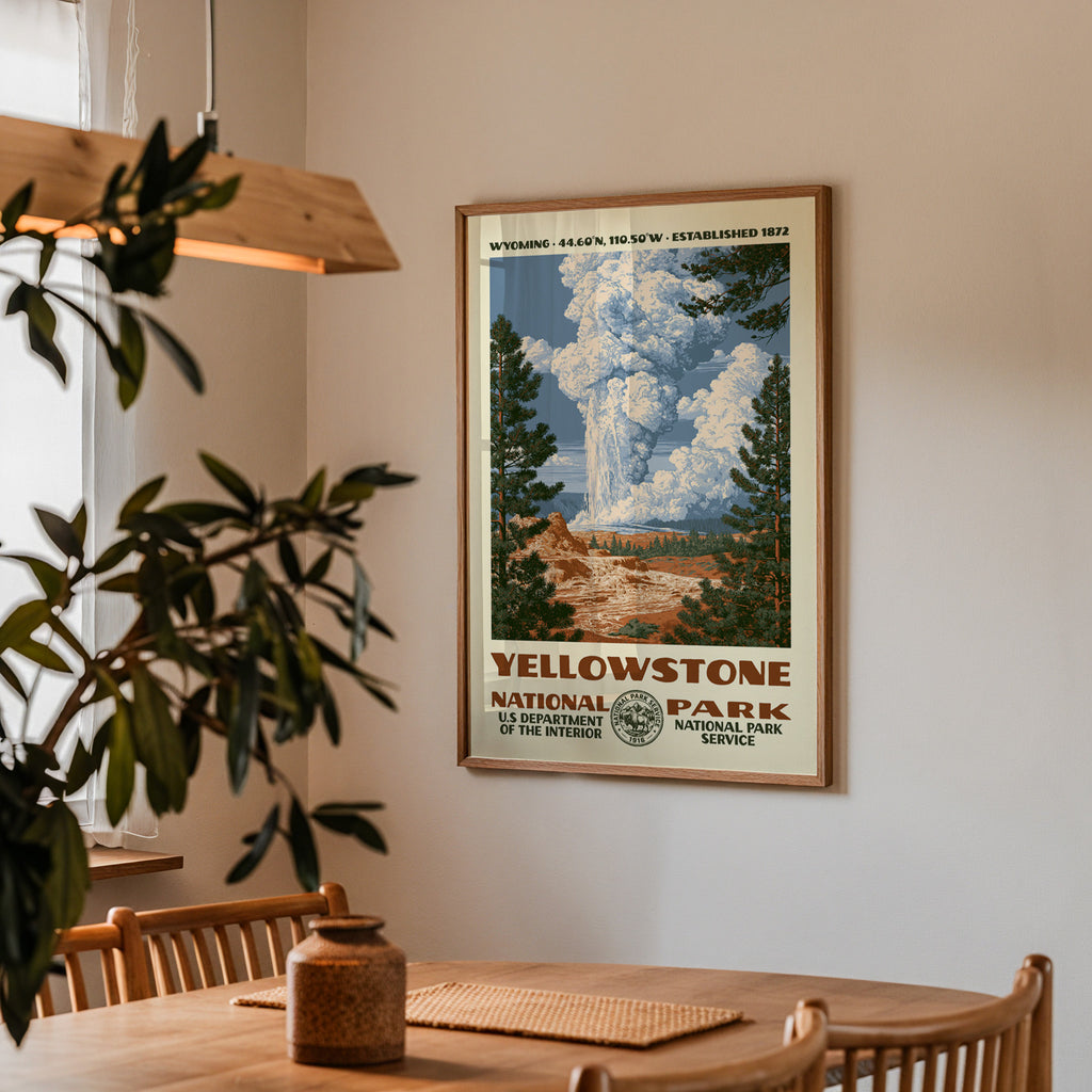 Yellowstone National Park vintage travel print hung above a wooden dining table under a pendant lamp