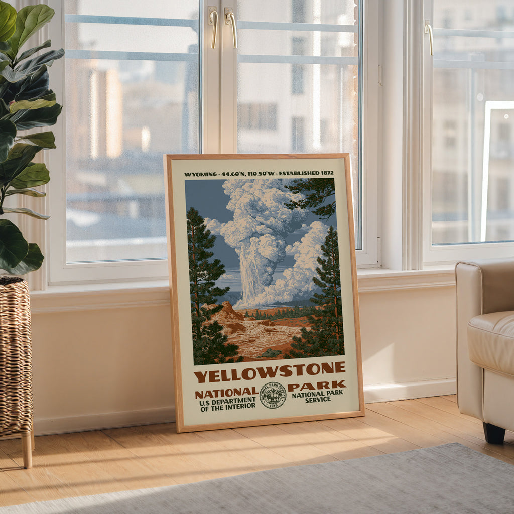 Yellowstone National Park WPA wall art in a wood frame by a tall window with a city skyline view