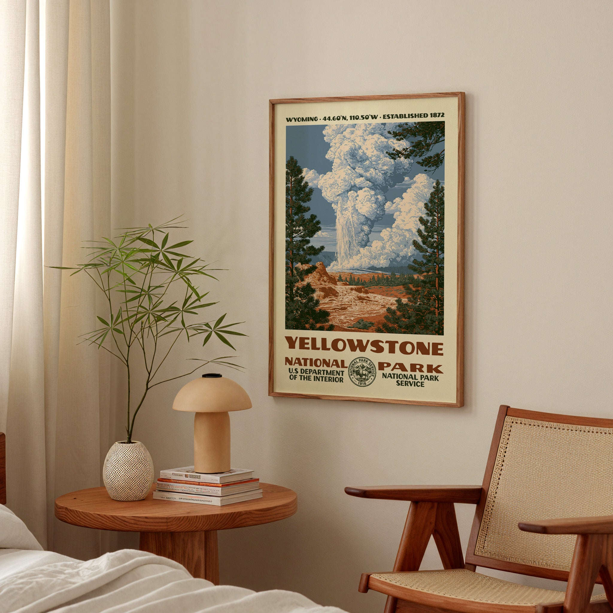 Yellowstone National Park vintage WPA print hanging above a side table in a calm bedroom corner