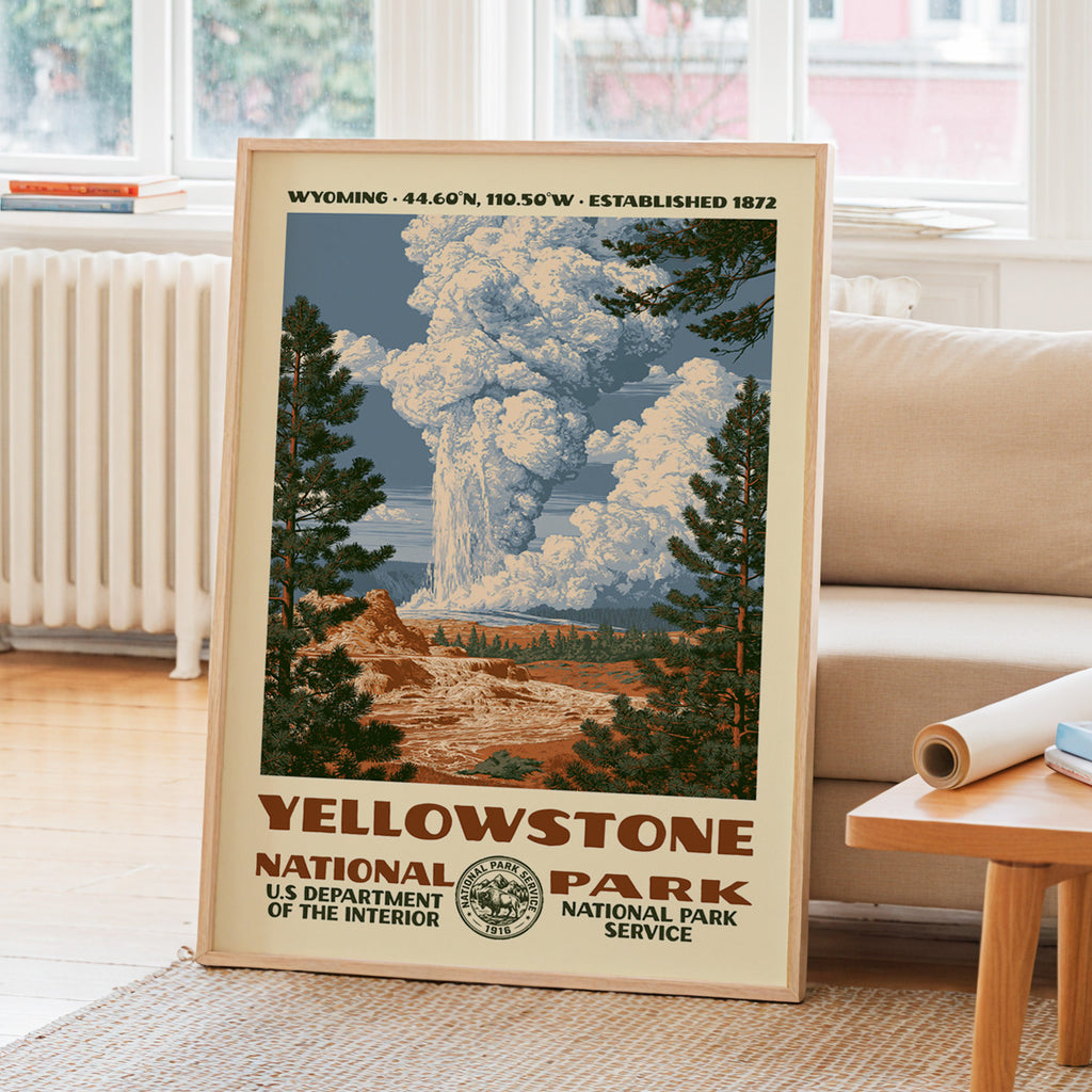 Yellowstone National Park WPA travel poster leaning on a sunlit living room wall beside a linen sofa