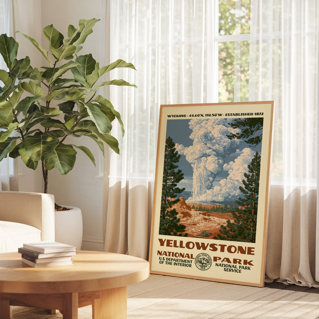 Yellowstone National Park retro art print propped on a round wood table by a bright window