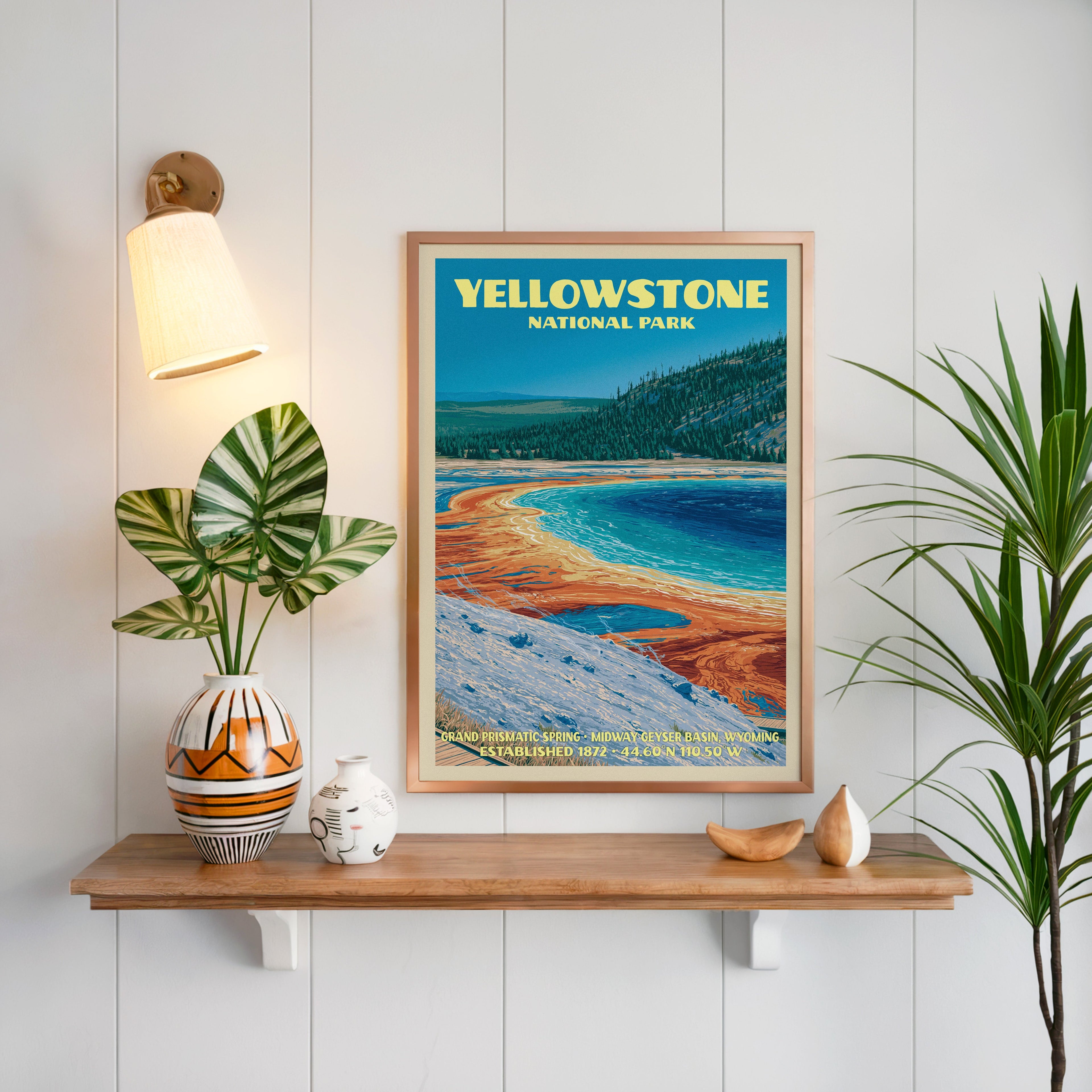 Grand Prismatic Spring print framed in oak on white panelling above a floating shelf with a patterned vase