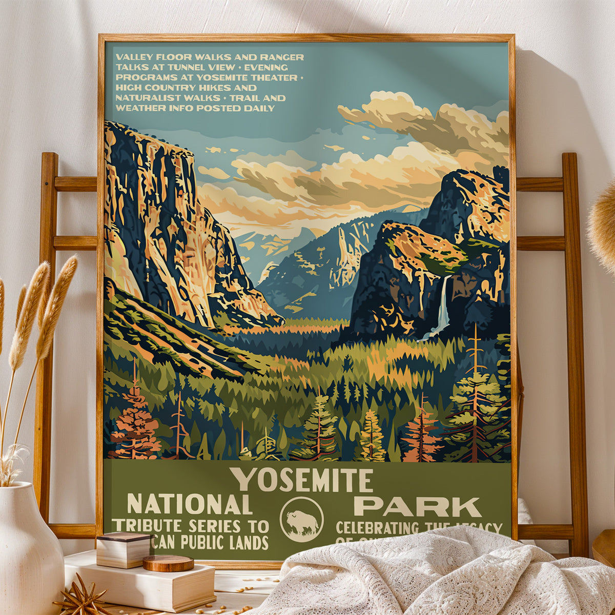 Yosemite National Park vintage print on a wooden stand with folded blankets and books