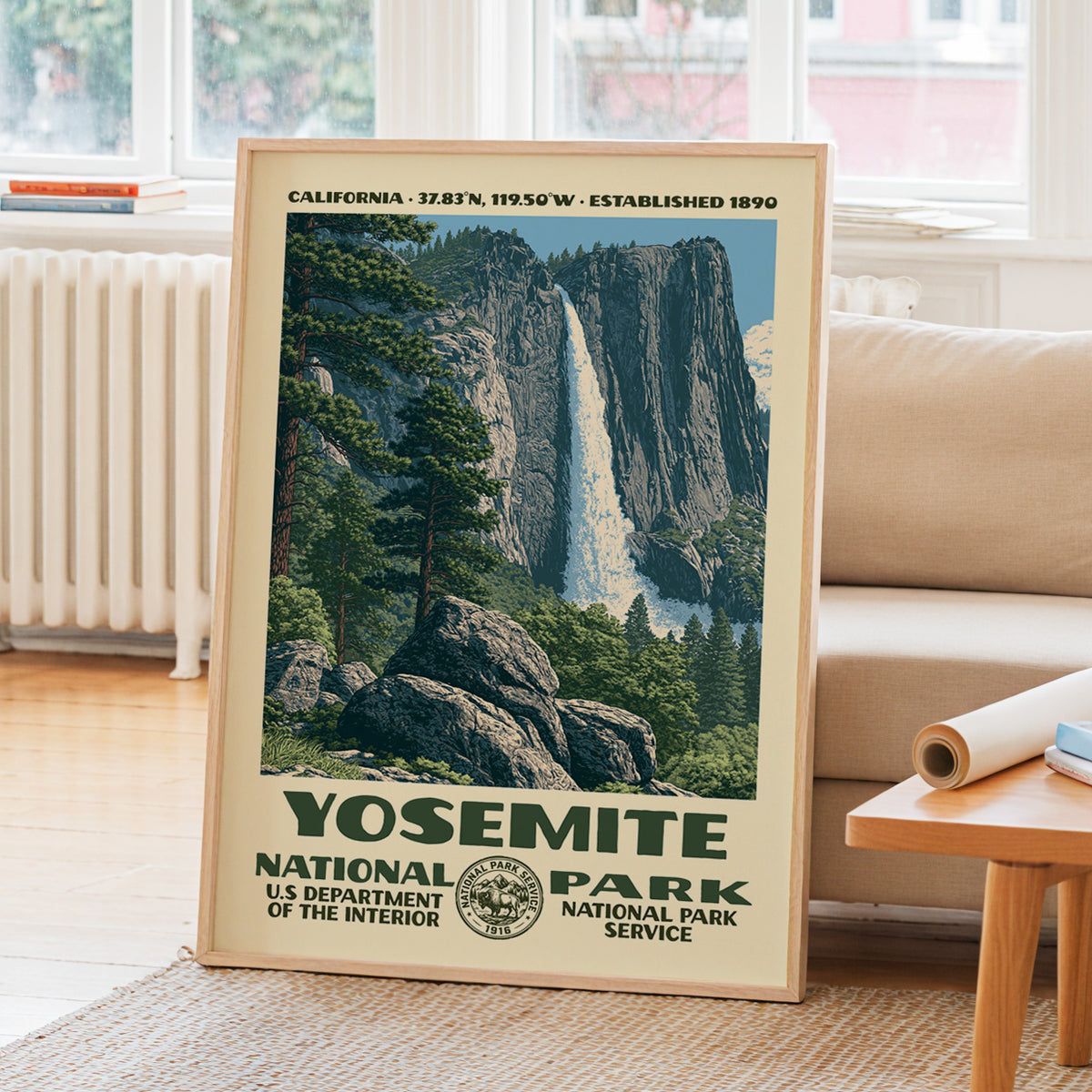 Yosemite National Park WPA travel poster leaning on a sunlit living room wall beside a linen sofa