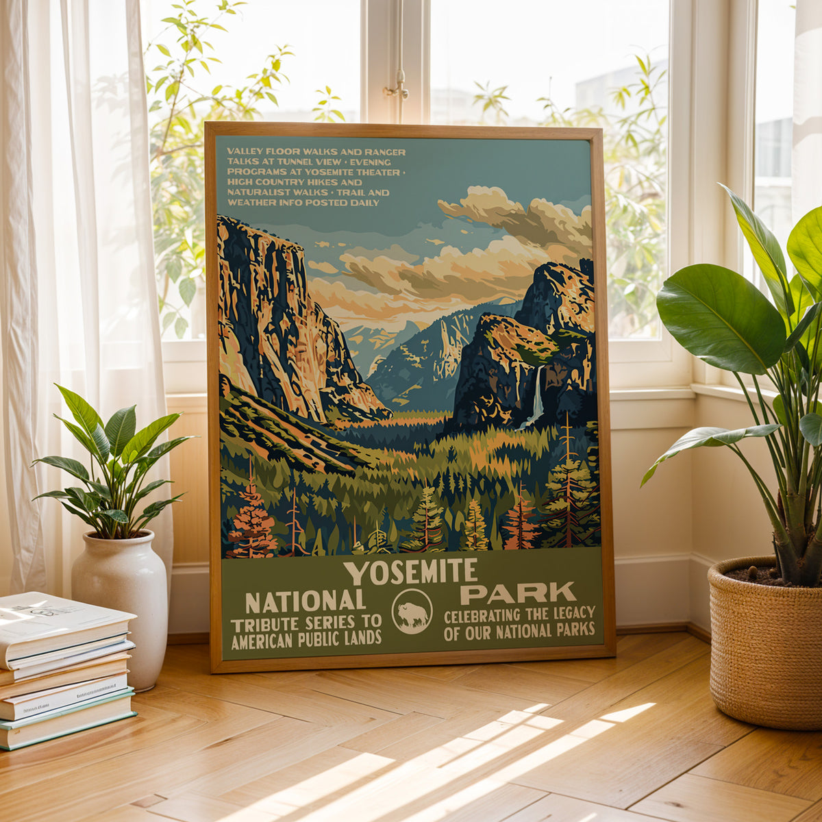 Yosemite National Park vintage print by a bright window with houseplants and books