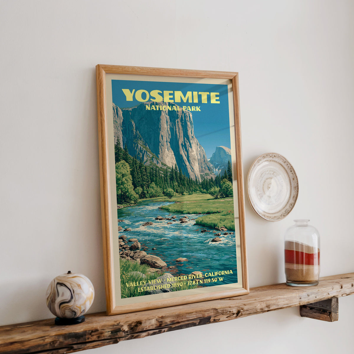 Yosemite Merced River print in oak, leaning on a reclaimed wood ledge with a marbled sphere and sand jar