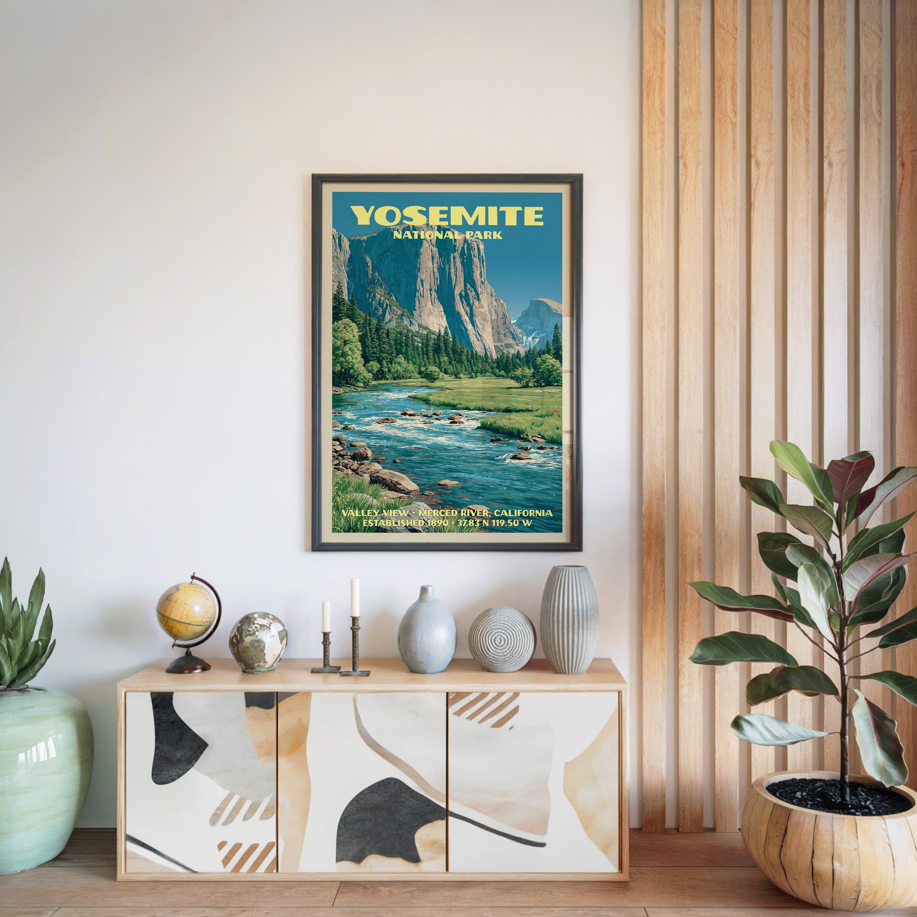 Yosemite National Park poster in a black frame above a light wood sideboard beside a slatted wall panel