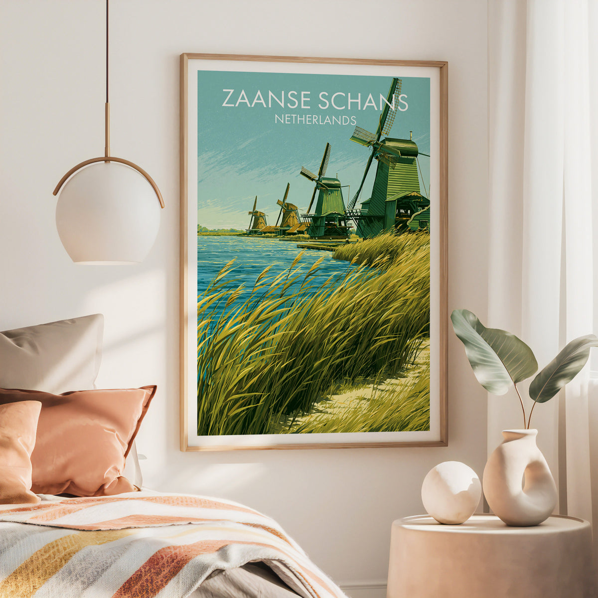 Zaanse Schans wall art, large oak frame above a bed with rust bedding and a brass globe pendant