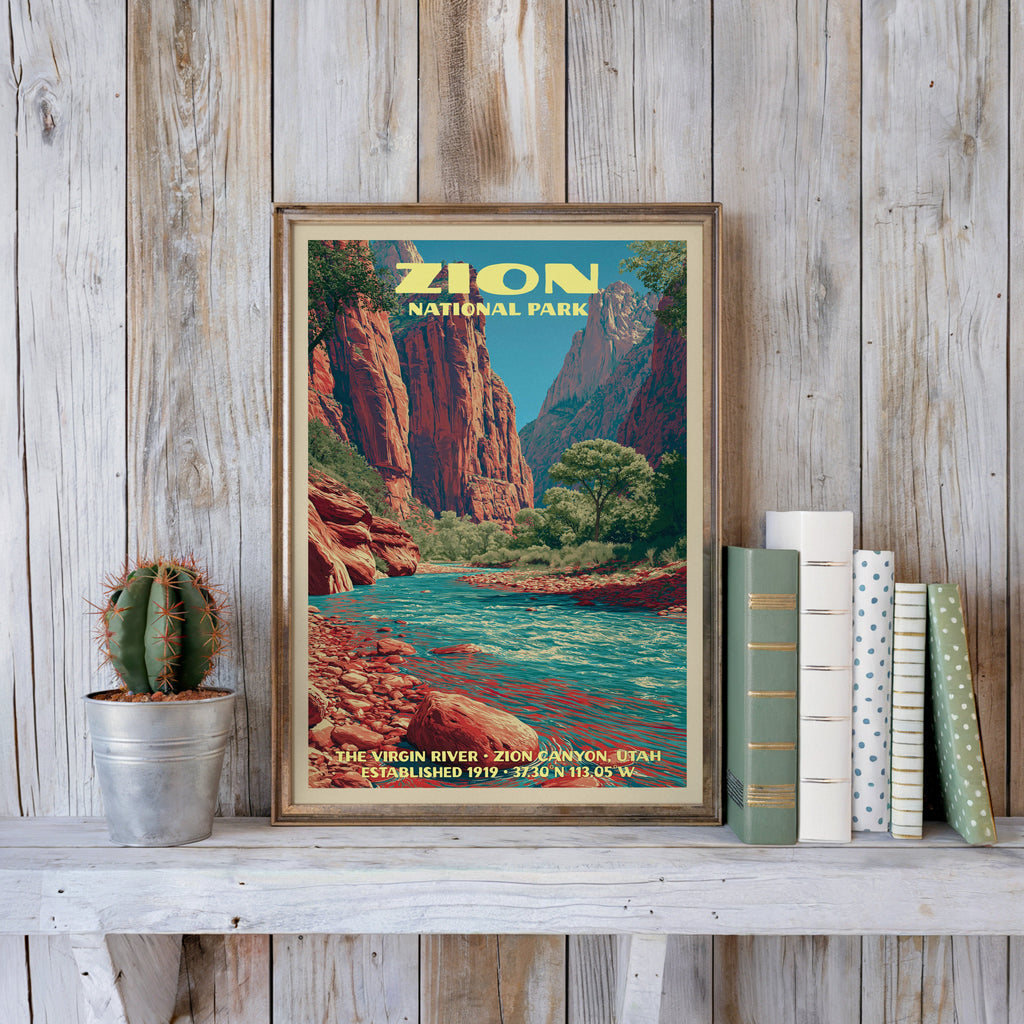 Zion vintage poster in a slim gold frame on a whitewashed plank wall beside a cactus and pastel books
