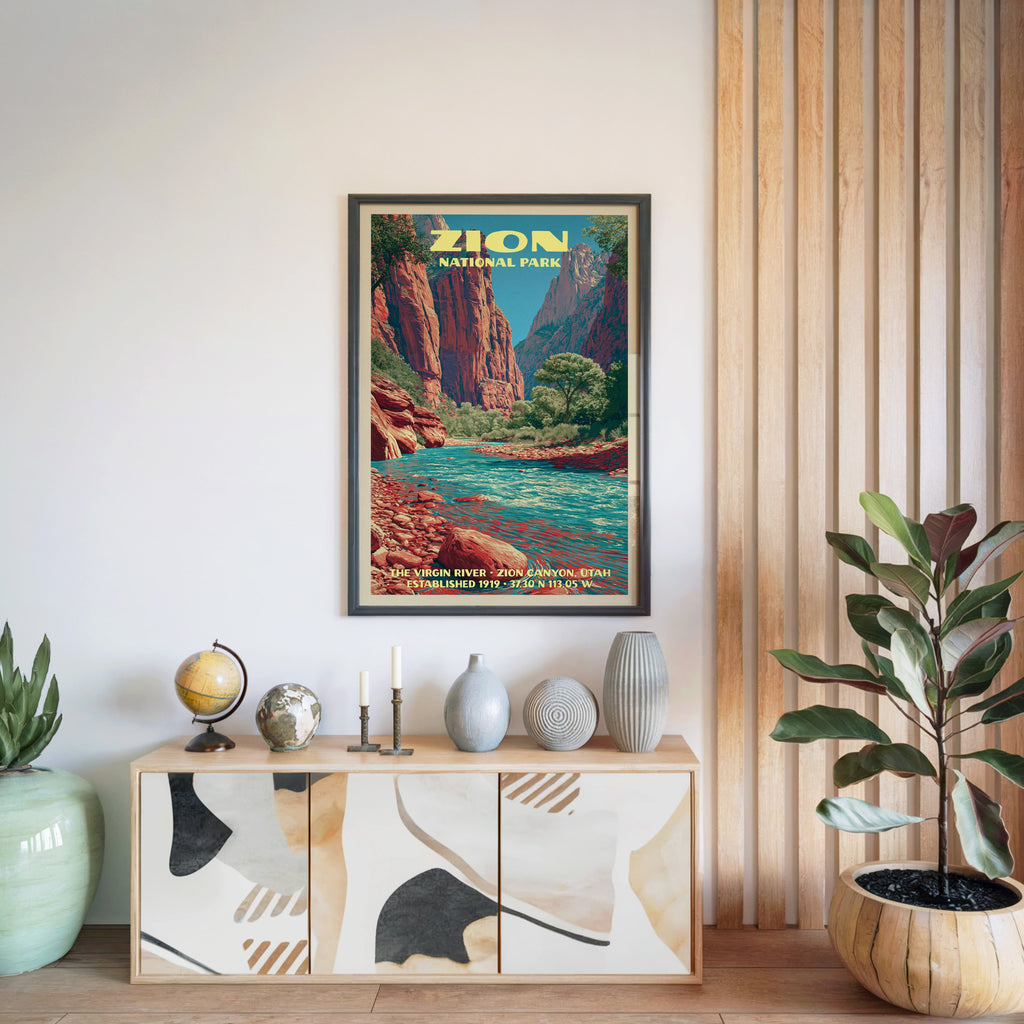 Zion National Park poster in a black frame above a light wood sideboard beside a slatted wall panel