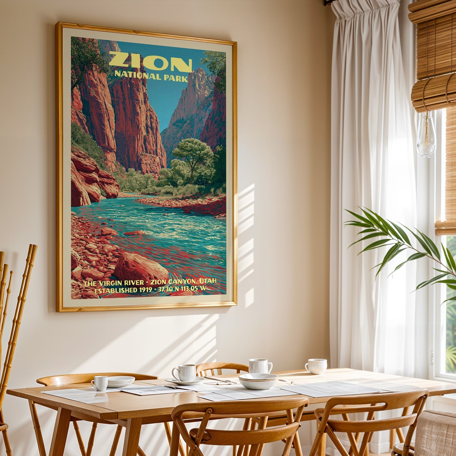 Zion National Park print in gold above a light oak dining table by a sheer-curtained window